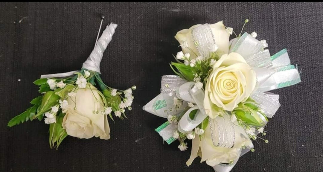 Spray rose wrist corsage &amp; boutonniere. SET -  Spray roses make up this wrist corsage and boutonniere. In the special instructions tell us what color the dress is and what color spray rose you like. If none is chosen white will be used