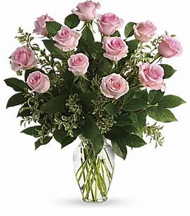 Dozen Pink Roses Dozen Pink Roses - Dozen pink roses in a clear vase with beautiful greens. This is a wonderful gift for a friend, Anniversary, birthday or any special occasion.