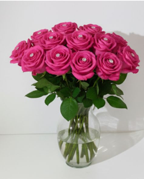 Dozen Diamond Luxe Pink Roses Dozen Diamond Luxe Pink Roses - These dozen pink roses with diamonds in the center of each bud are classic! Perfect romantic gift for a Birthday, Valentine's Day or an Anniversary. APPROXIMATE DIMENSIONS: 25" H X 18" W