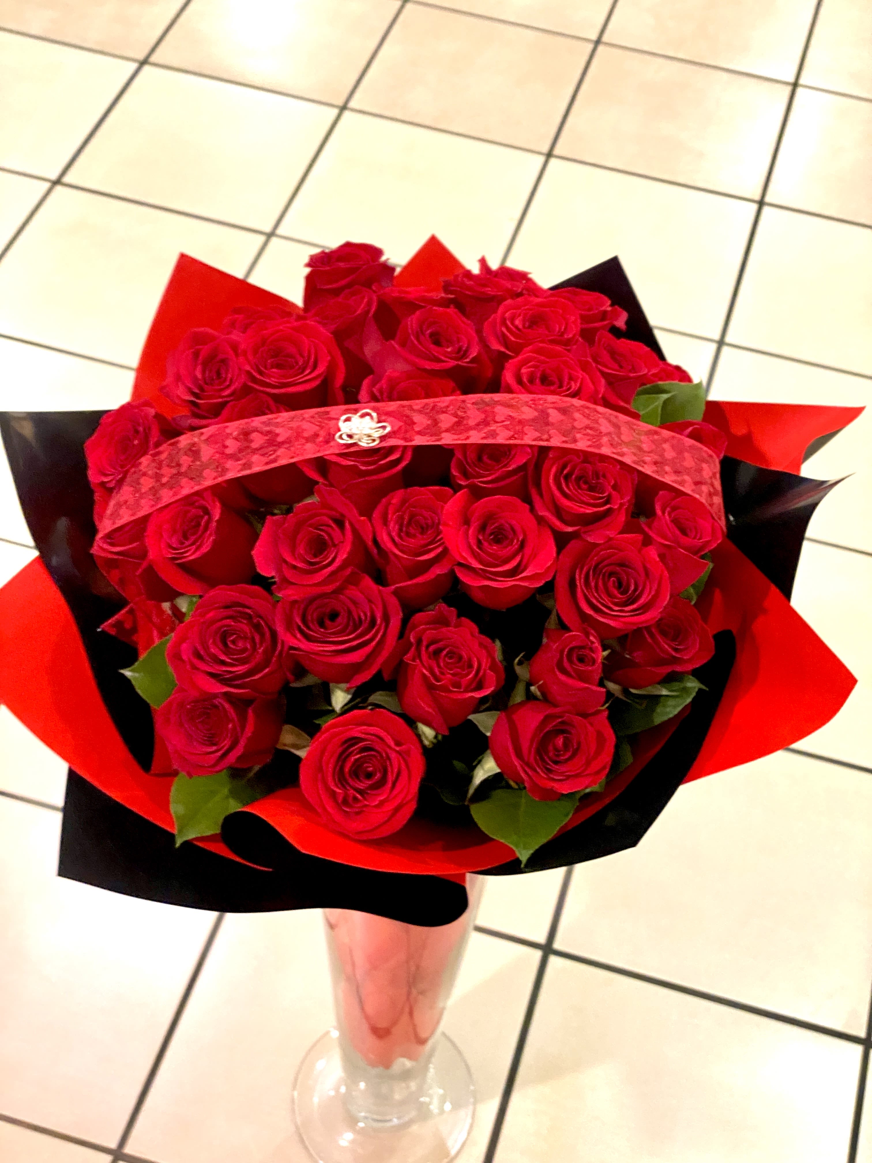 In Love In Love - 3 dozen red rose wrap with black and red waterproof paper. 18"W 27"H