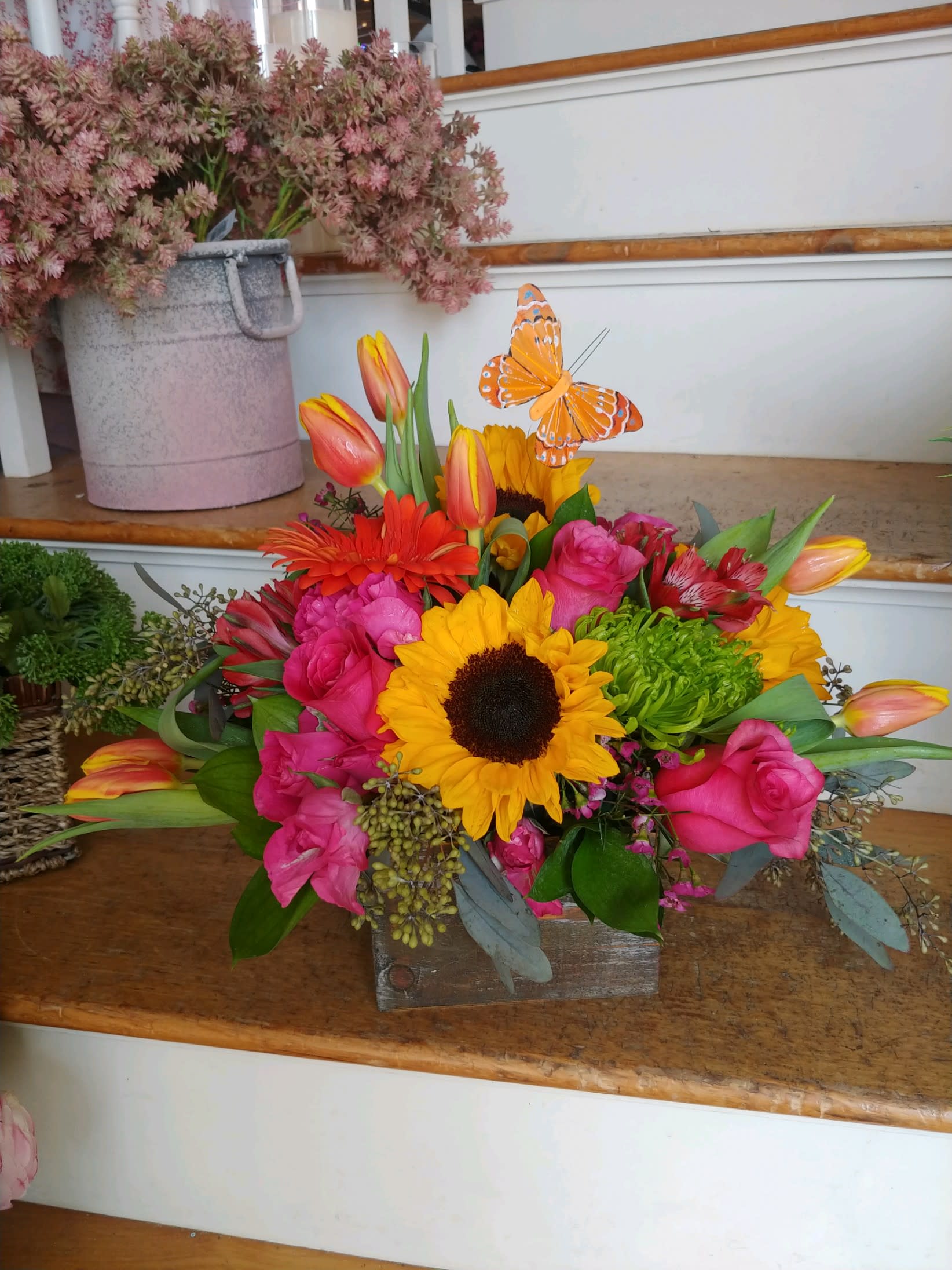 Bursting Butterfly Box - Roses, tulips, sunflowers, gerbera daisies and alstromeria designed in a wooden box with a butterfly