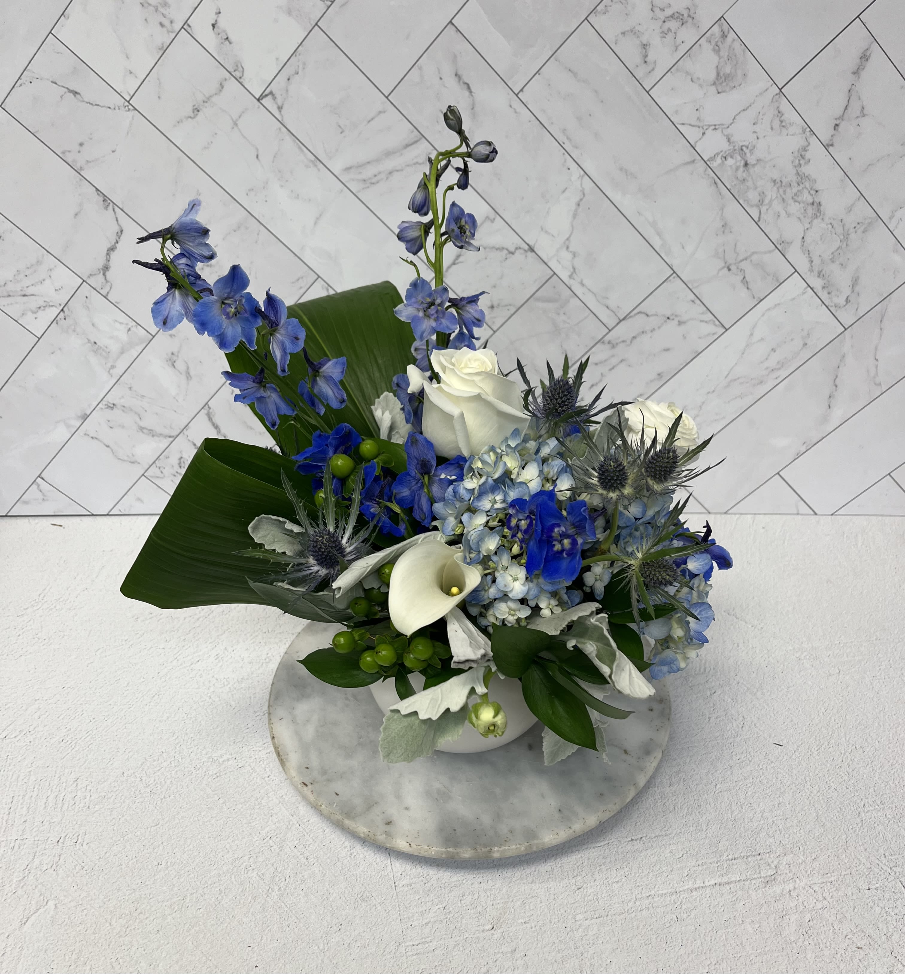 The Shield of Valor The Shield of Valor - The Blues and Whites in this Arrangement are a meaningful way to honor the bravery of any loved law enforcement official.