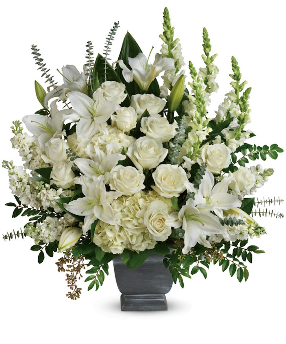 True Horizons Bouquet - A striking and graceful tribute, this large vase arrangement showcases an elegant selection of pure white flowers.