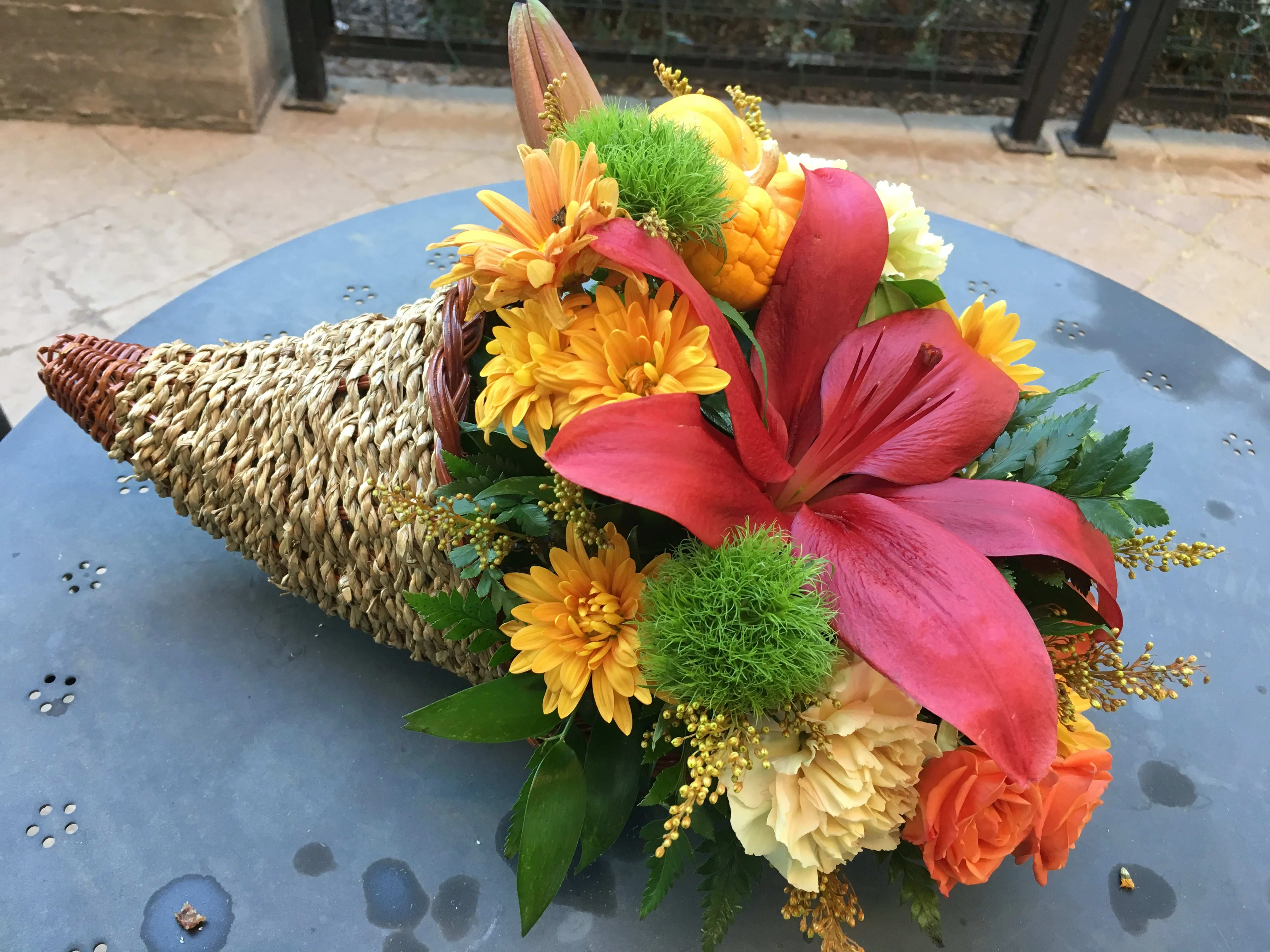 Cornucopia of Fall flowers - A basket full of flower blessings!! Fresh seasonal blooms to include Lilies, Chrysanthemums, roses and more!! 