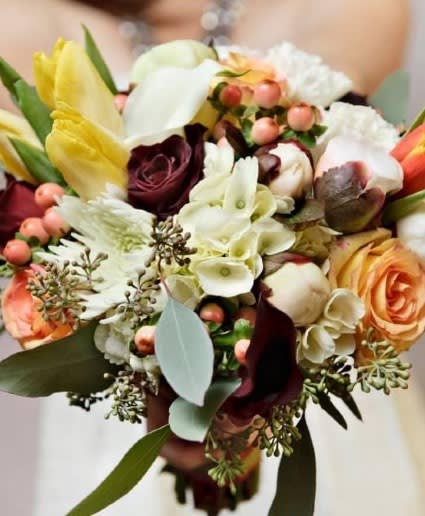Autumn Designer's Choice - As a designer’s choice arrangement, our team will use only the most beautiful and fresh product in the shop to create a beautiful arrangement in fall colors. All seasonal flowers will be used.