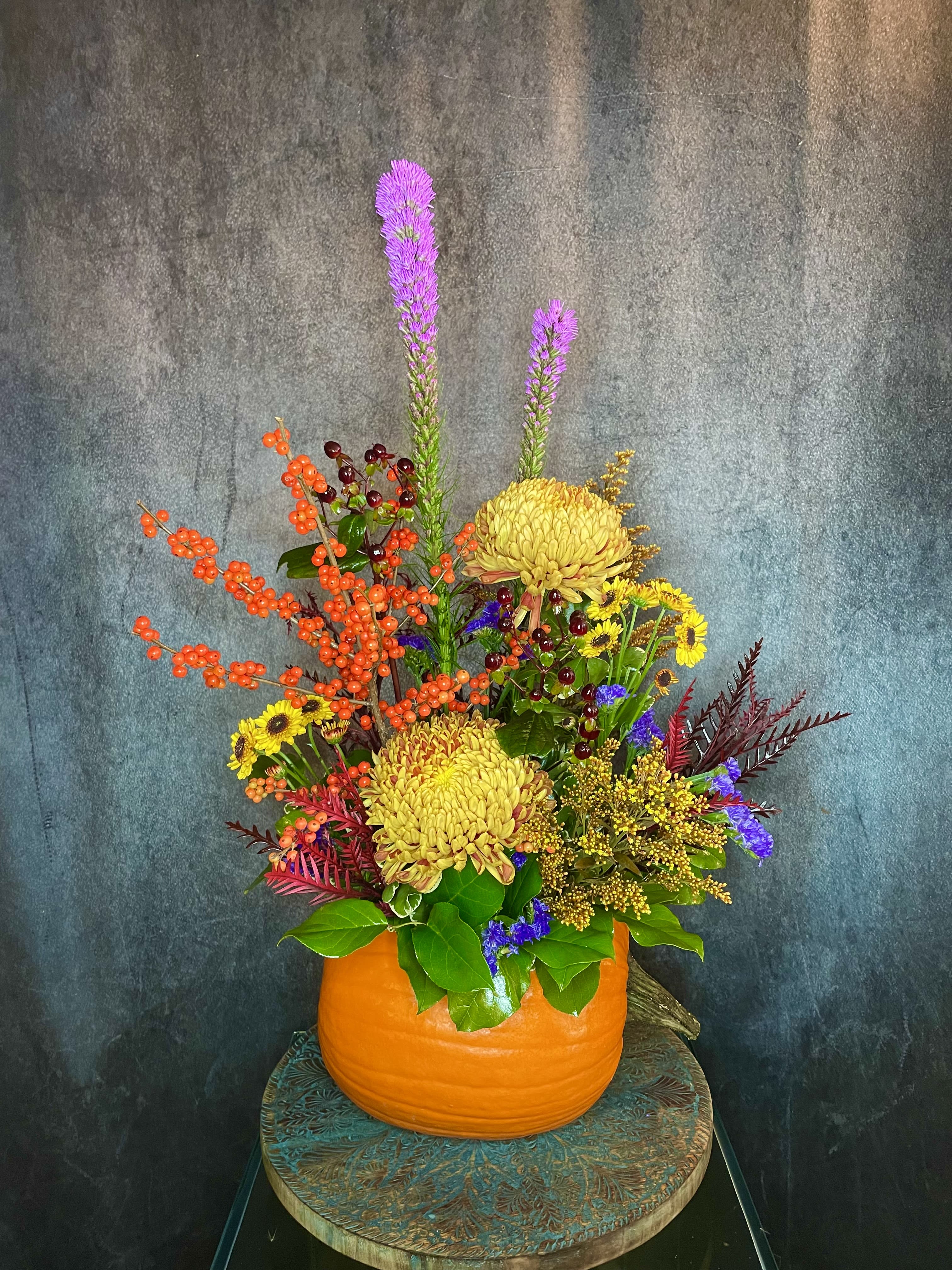 Precious Pumpkin  - &quot;Precious Pumpkin&quot; is very unique design, as no two Pumpkins are alike! A fall floral art piece arranged in a fresh pumpkin, this precious show stopper is sure to add an autumnal flair to any room or event! 