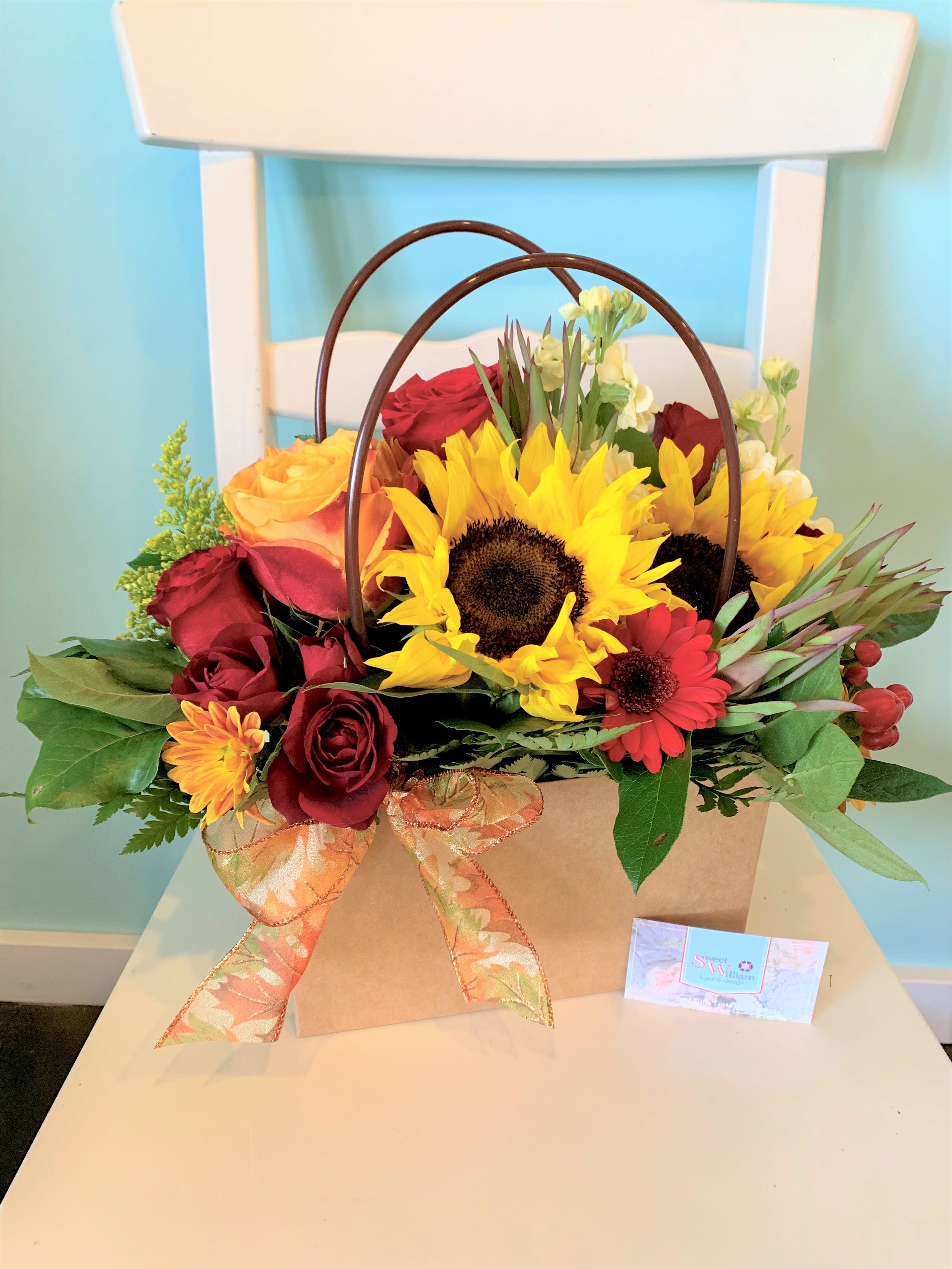 Bag of Blossoms ~ Fall Edition Bag of Blossoms ~ Fall Edition - Our popular Bag of Blossoms arrangement with an autumn twist! Bring the warm colors of fall inside your house. Great for office desks, coffee tables, and dinner tables!