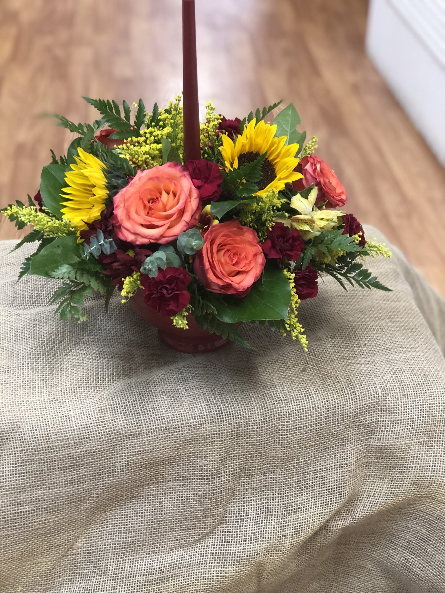 Autumn center piece Autumn center piece - This autumn center piece will really stand out on the dinner table with its single candle and all the vibrant autumn colors.