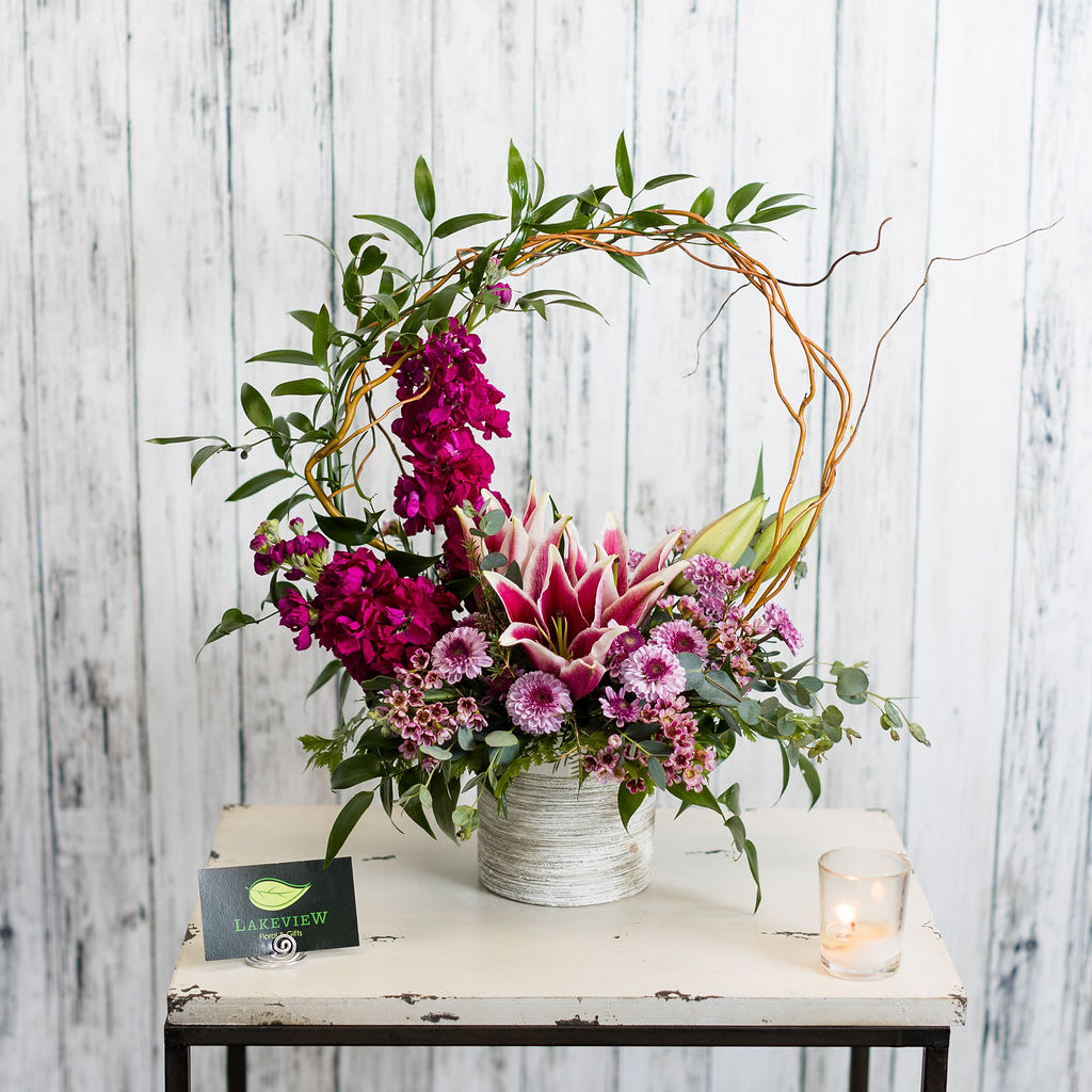Stargazing Stargazing - Vivid and cheerful, this pink and white bouquet of lilies, stock and cushion mums accented with trailing greens is sure to bring anyone a smile! Approximate Dimensions: 16" T X 12" W