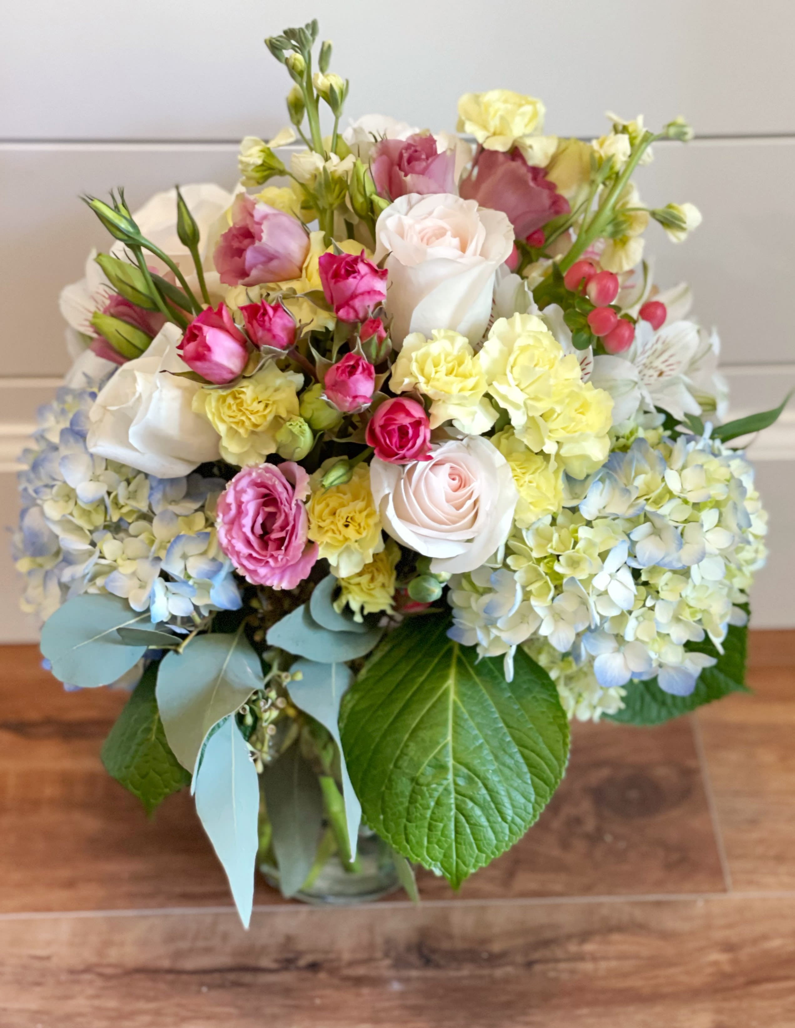 English garden deluxe in a vase - Hydrangeas, roses, and other delicate seasonal flowers.