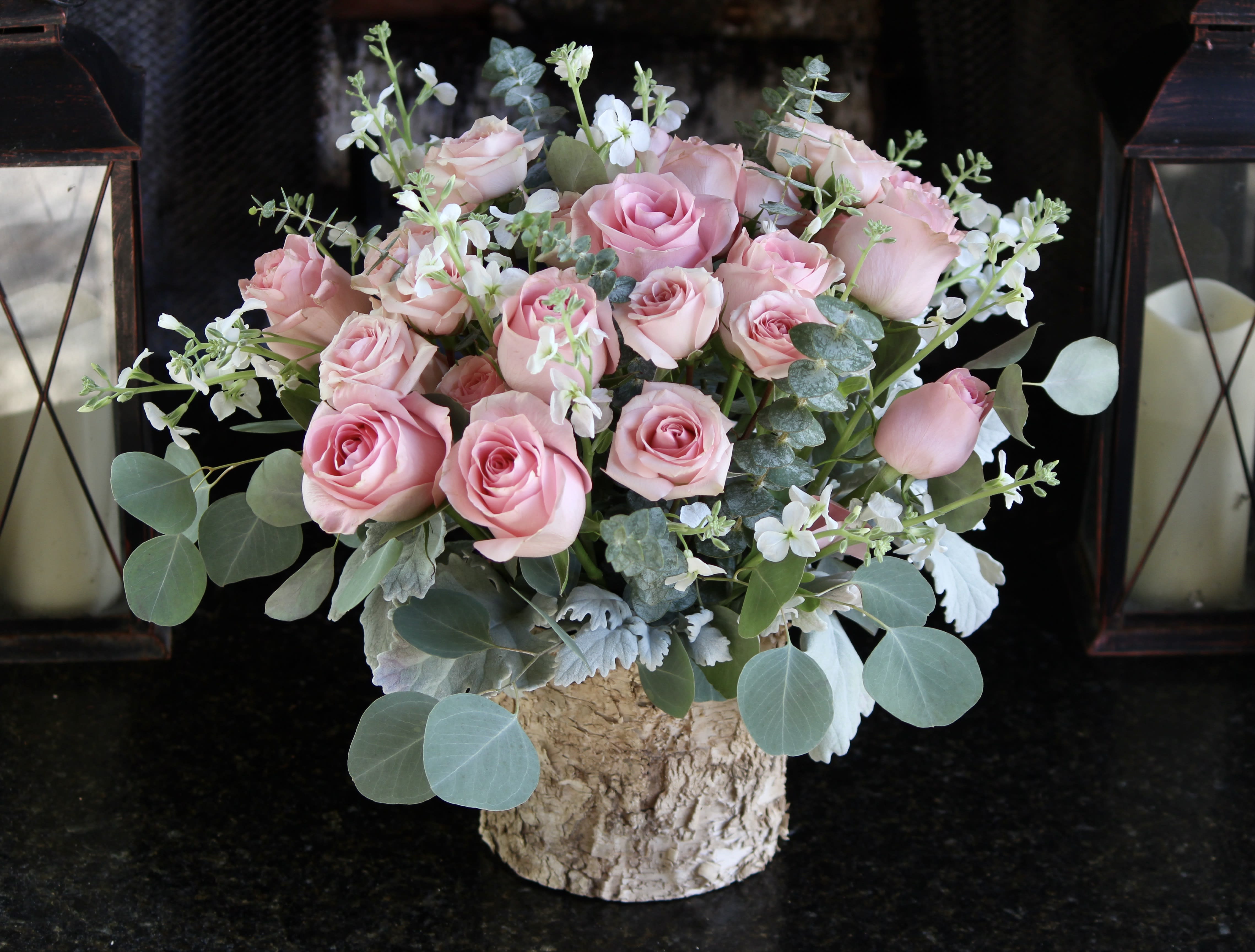 The Sweetest Thing - Pink roses and stem roses With small white seasonal flowers and greenery in sage and light green colors.