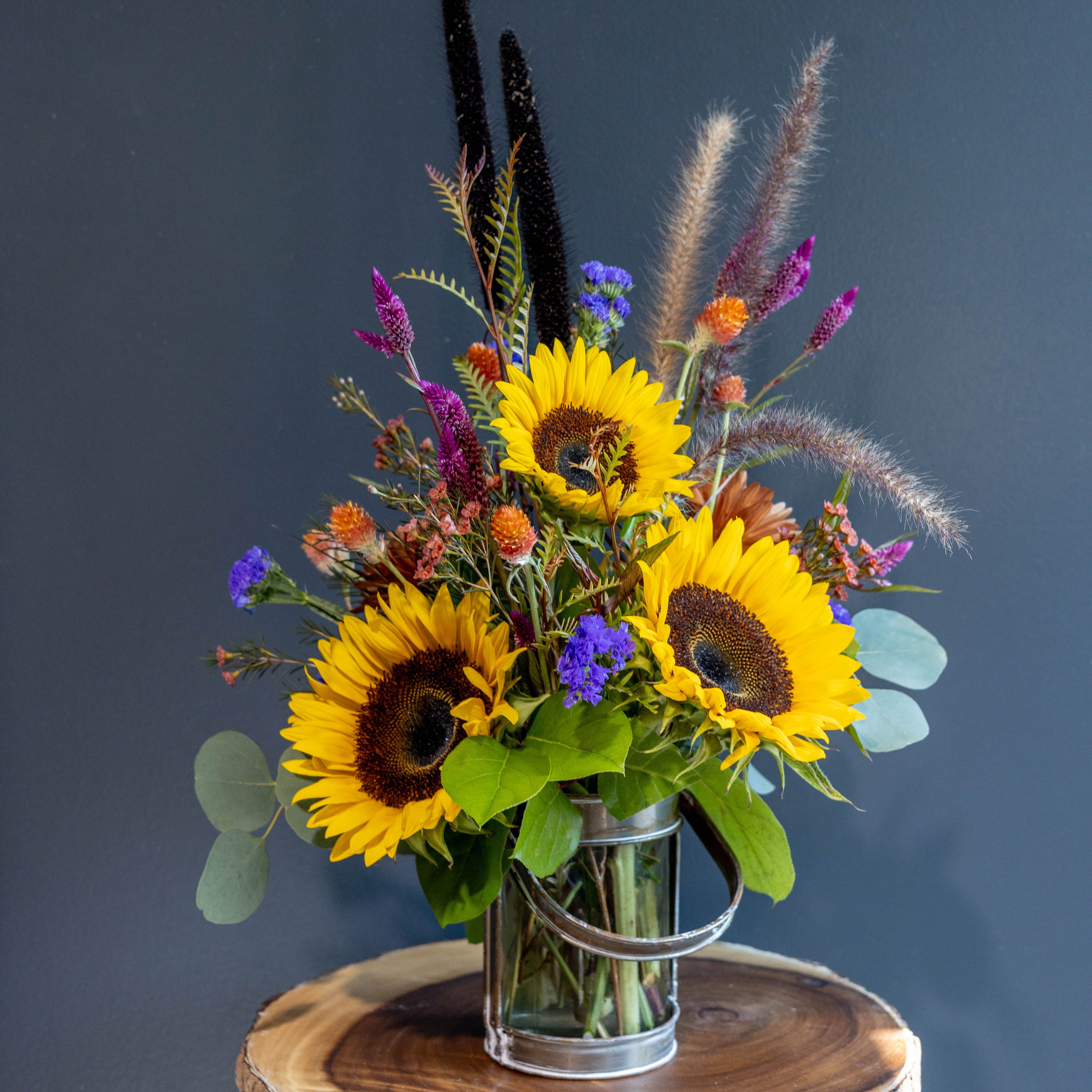 Autumn Harvest - Autumn Harvest not only is it full of our flowers from RDS Farms but in a unique glass handled vase that can be used to fill with sunshine anytime!