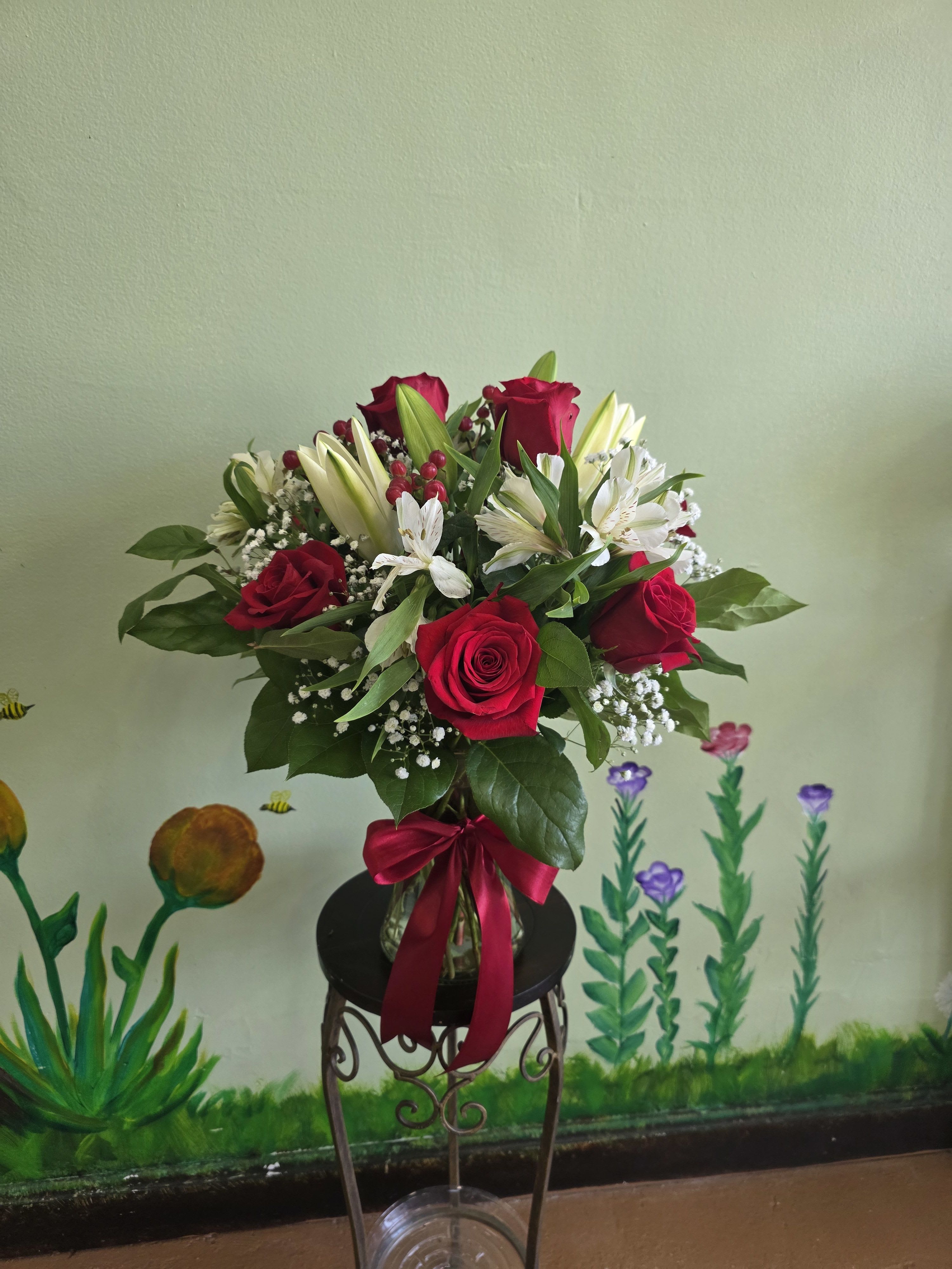 Red &amp; White Delight - A fresh mix of red roses, white lilies, and lush greenery arranged in a clear vase with a satin bow. A simple yet timeless gift for any occasion.