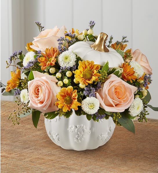 Autumn Essence Pumpkin Medley -  Arrangement with peach roses, white button poms, autumn-colored daisy poms and purple limonium; accented with cream hypericum, seeded eucalyptus and assorted greenery