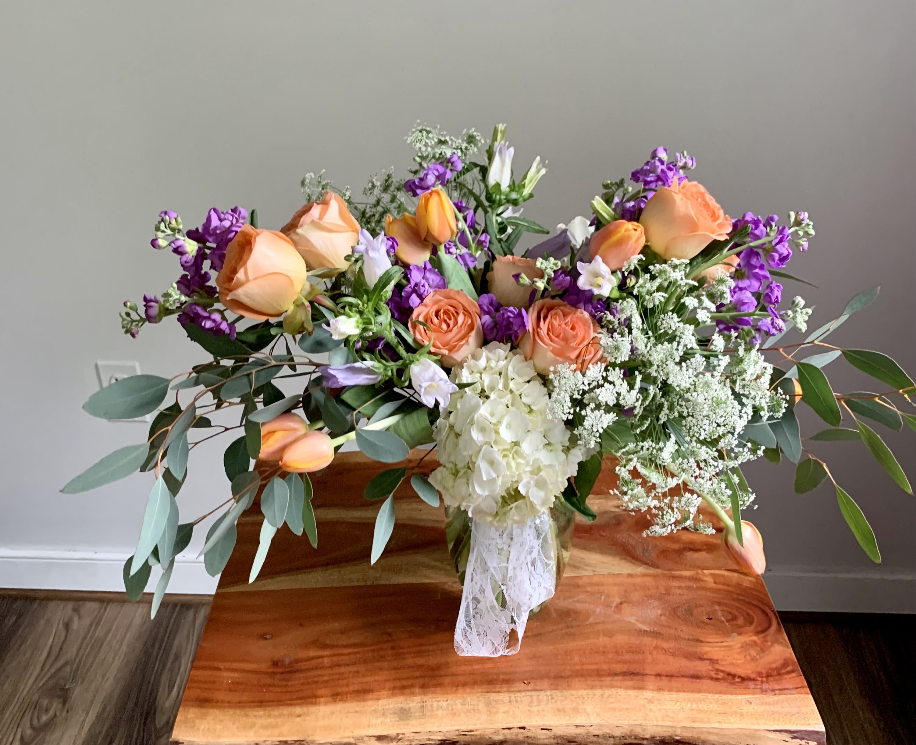 Sophie's Garden Arrangement Sophie's Garden Arrangement - Indulge in the captivating beauty of Sophie's Garden Arrangement, inspired by the charm of French farmhouses. Featuring a delightful blend of soft peach and lavender hues, this arrangement will add an elegant touch to any space. Bring the essence of a serene garden into your home with Sophie's Garden Arrangement.