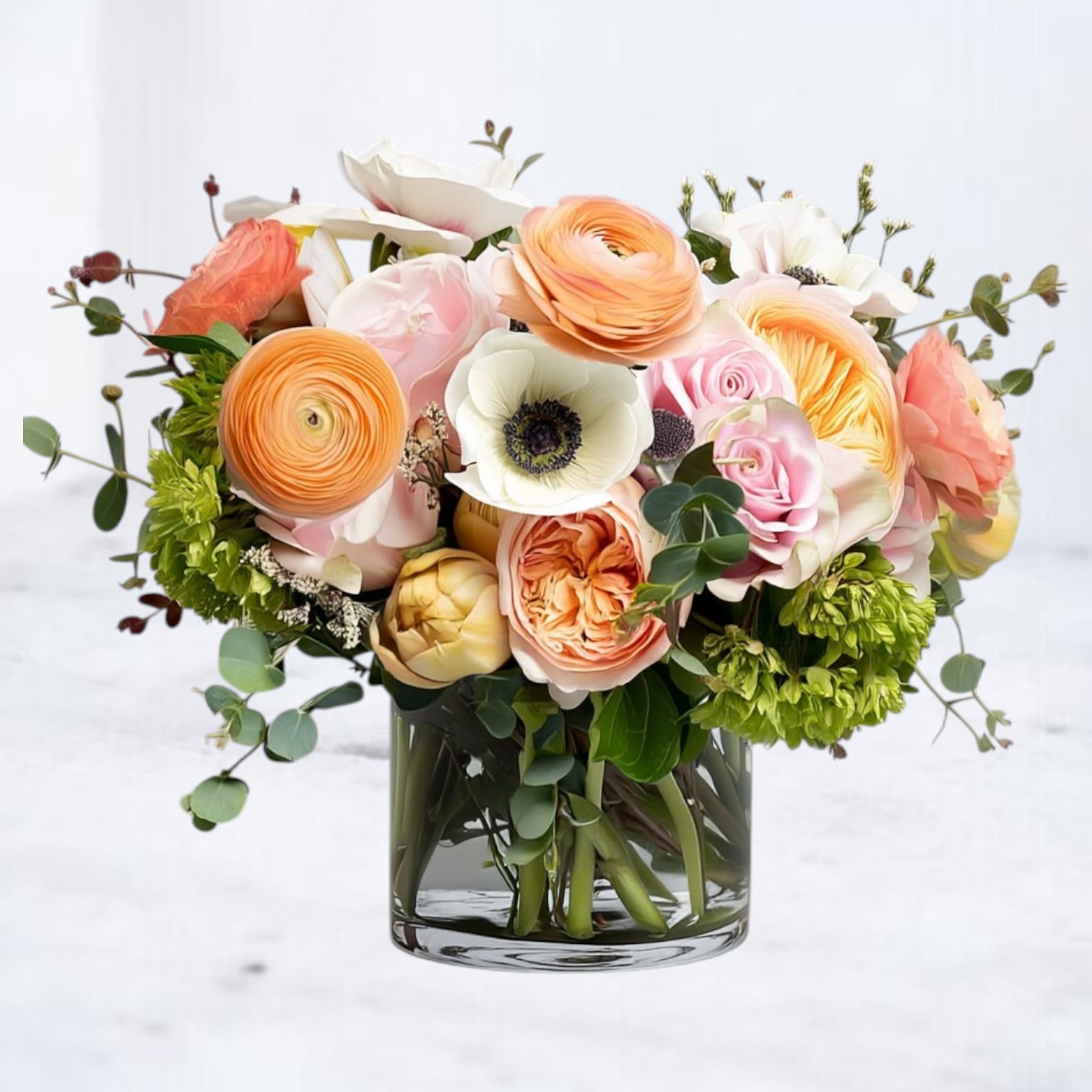 Elysian Bloomscape Elysian Bloomscape - Discover the ethereal beauty of the Elysian Bloomscape, a one-of-a-kind floral arrangement crafted to evoke a sense of serenity and splendor. This exquisite design features blush roses, peach ranunculus, yellow tulips, and verdant hydrangeas, delicately arranged with eucalyptus and natural accents for a fresh, organic feel. Ideal for marking life’s special moments or as a luxurious centerpiece, the Elysian Bloomscape brings timeless elegance to any space. With same-day delivery in Houston and nearby areas, your heartfelt sentiments are just a bouquet away.