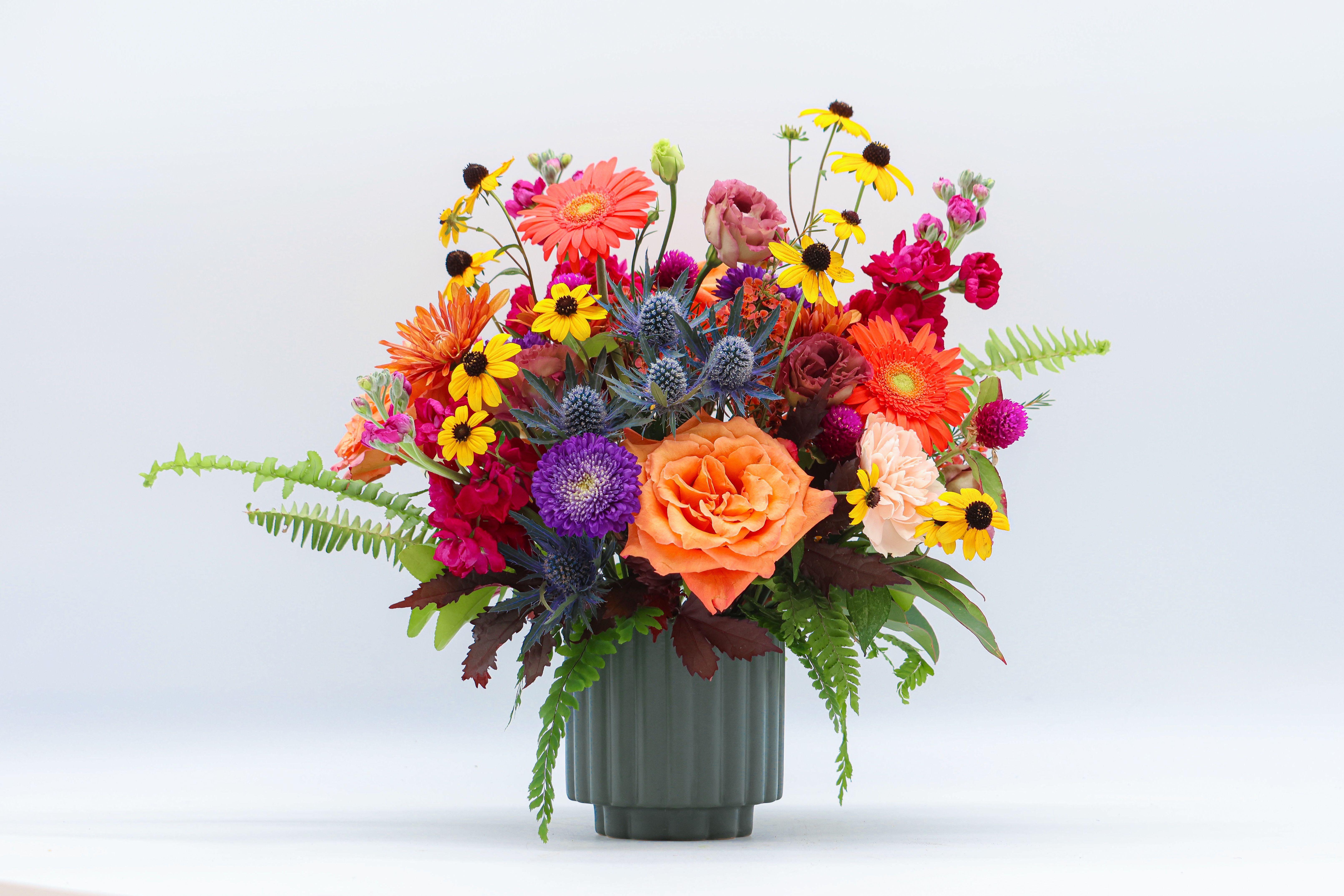 Harvest Moody Harvest Moody - Whimsical fall assortment with pops of dark and moody colors. Created in a green ceramic vase.