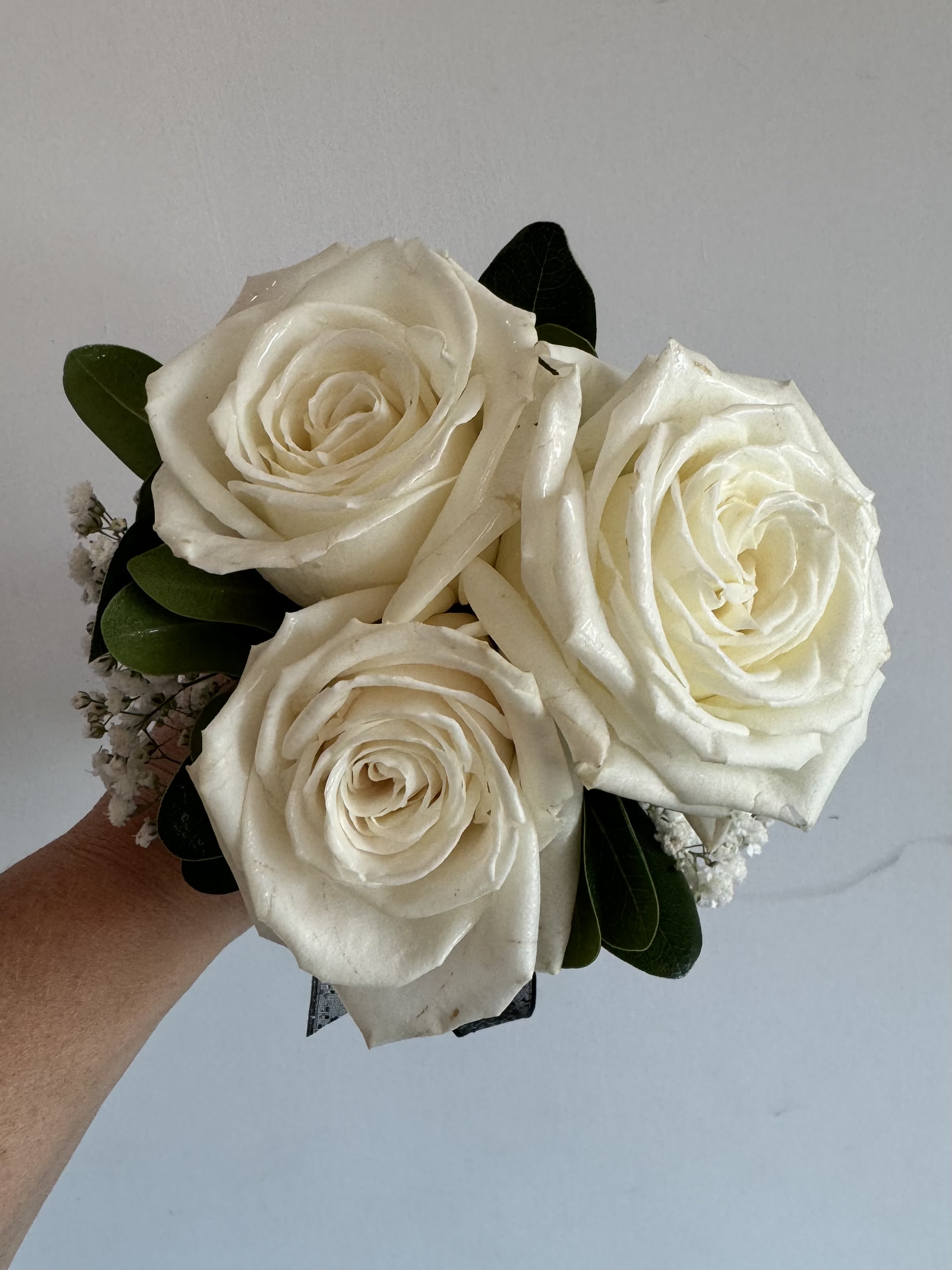 Hand held bouquet- roses - This cute bouquet features 3 white roses, babies breath and greenery. You may choose a ribbon color by telling us in the notes.