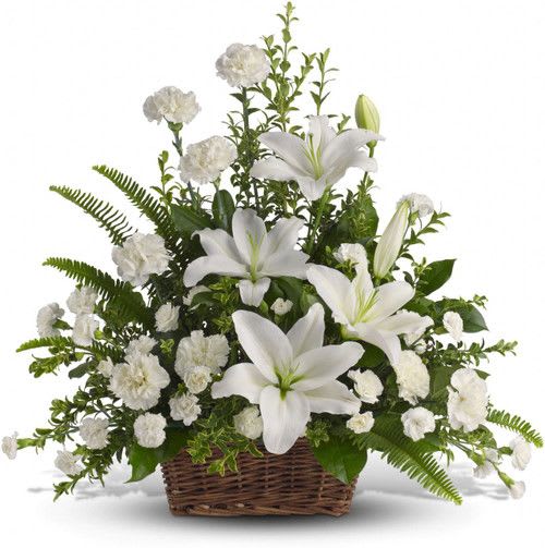 Peaceful White Lilies Basket - As peaceful and beautiful as a starry night, this pure white funeral bouquet is a touching way to remember a truly special person. Send this classic arrangement to comfort the newly bereaved at the funeral.