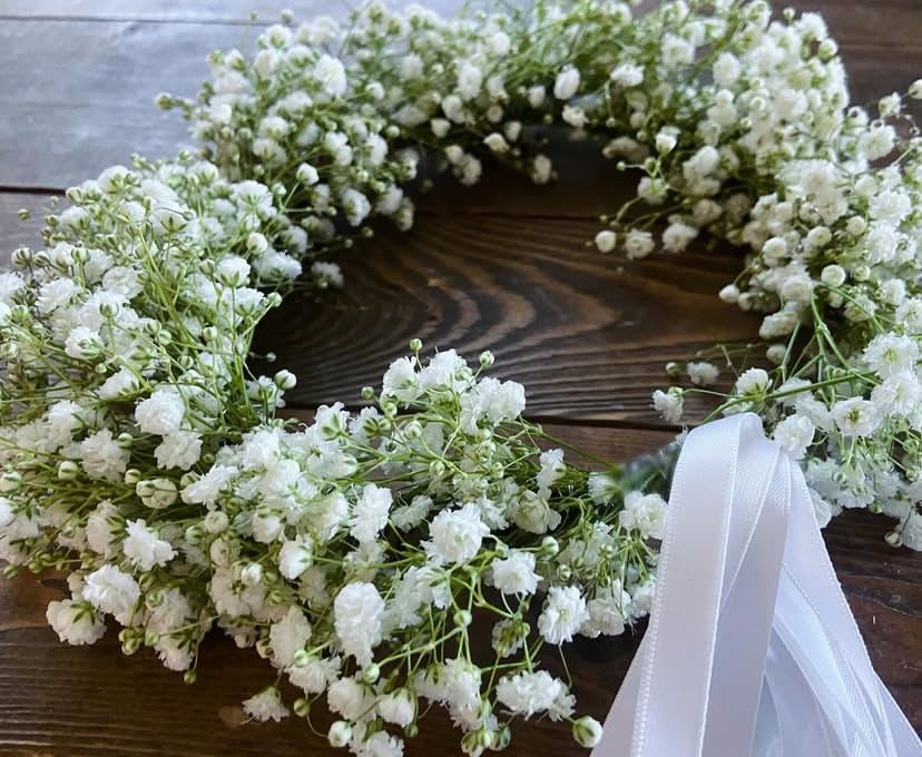Whisper Crown  - An airy halo of clustered baby’s breath, hand-tied with a satin ribbon for a touch of understated grace. Soft, ethereal, and timeless, this crown captures purity and simplicity with a modern elegance. Perfect for flower girls, brides, first communions or anyone seeking a refined accessory that feels effortless yet enchanting. A piece designed not just to wear, but to experience — the poetry of flowers in its most delicate form.  *One day in advance ordering is required for flower crowns.* 