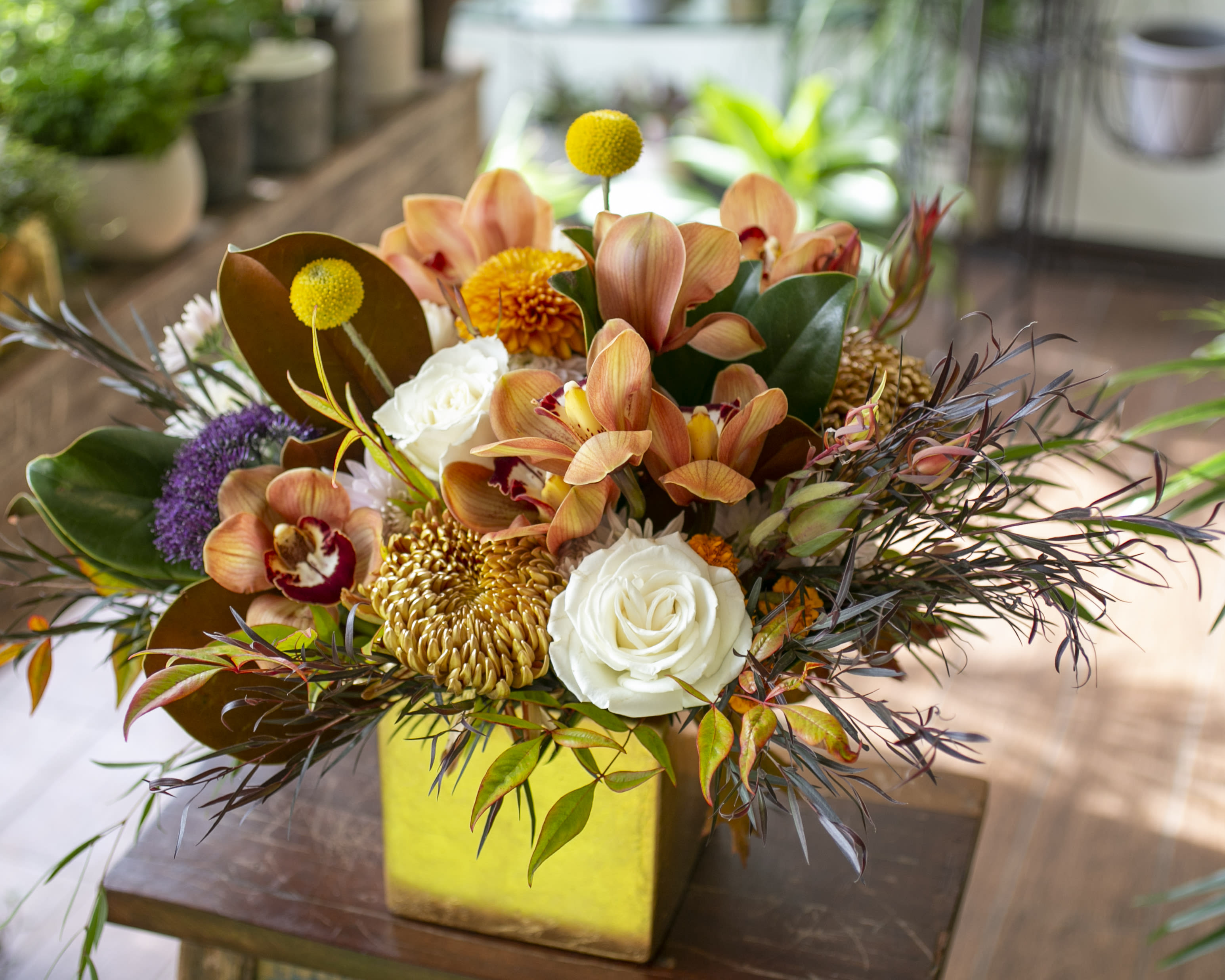 William - Bronze, gold, yellow, white, burgundy! Arranged in a gold, bronze or copper (colors) ceramic vessel.