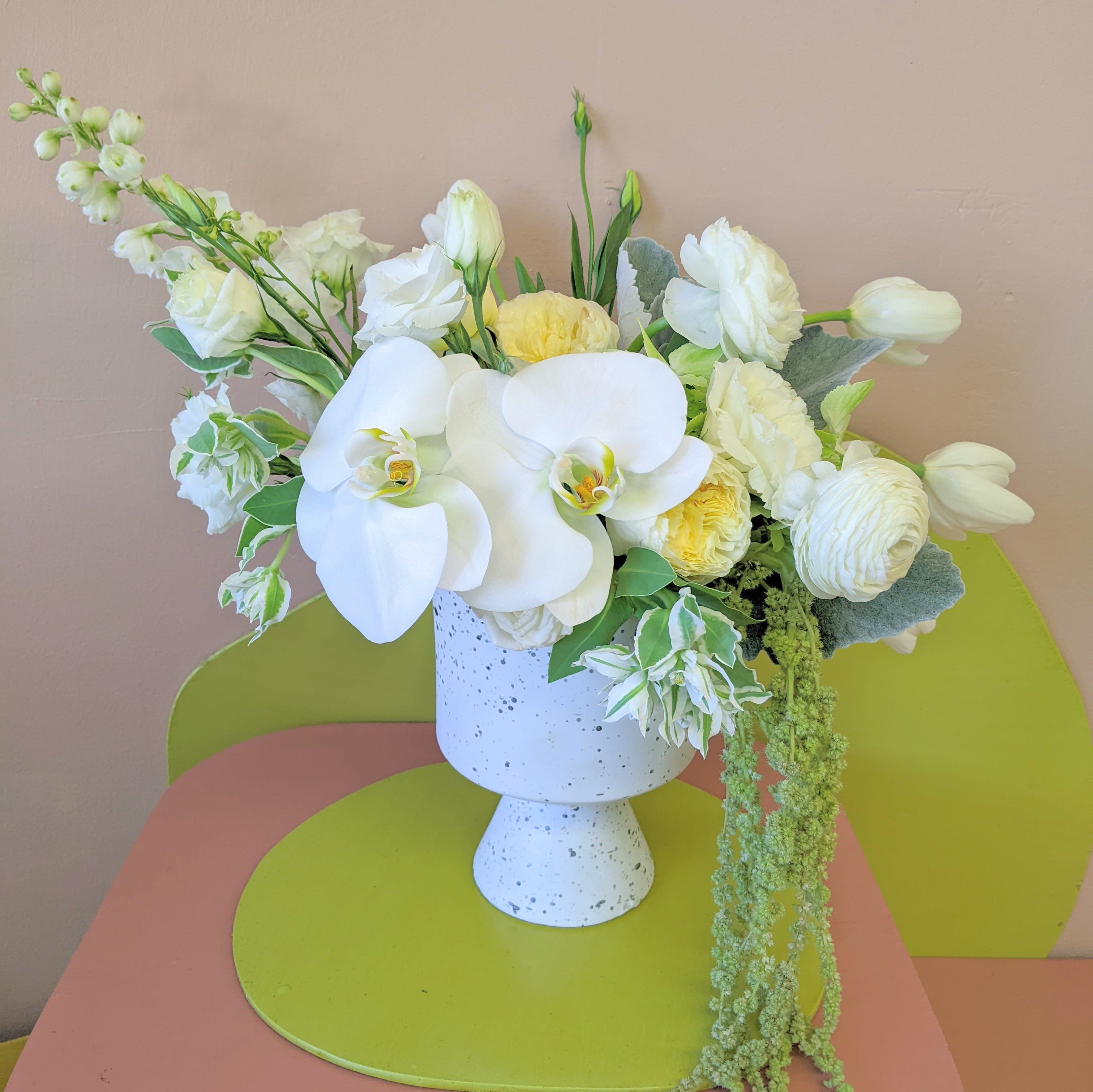 Cool like Summer  - A fresh all white arrangement including garden roses and orchids comes in a white speckled ceramic pedestal vase and is perfect for any occasion where elegance is preferred. 