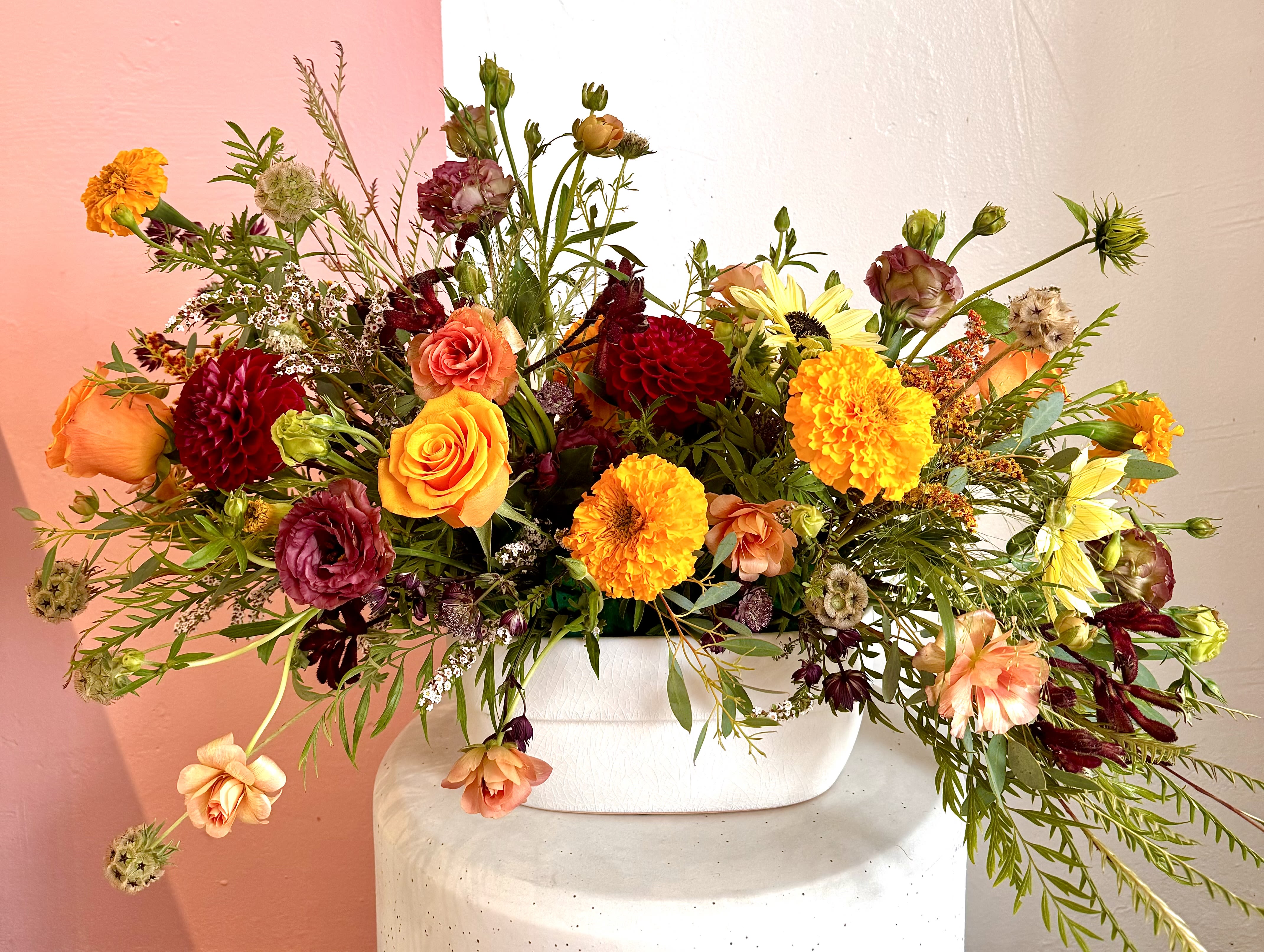 Falling For You Falling For You - A beautiful fall inspired arrangement, perfect to sit on any table. Made up of variety of seasonal flowers including dahlias, roses and lisianthus. created in a white oval ceramic container. ***flowers and container are subject to substitution due to seasonal availability***
