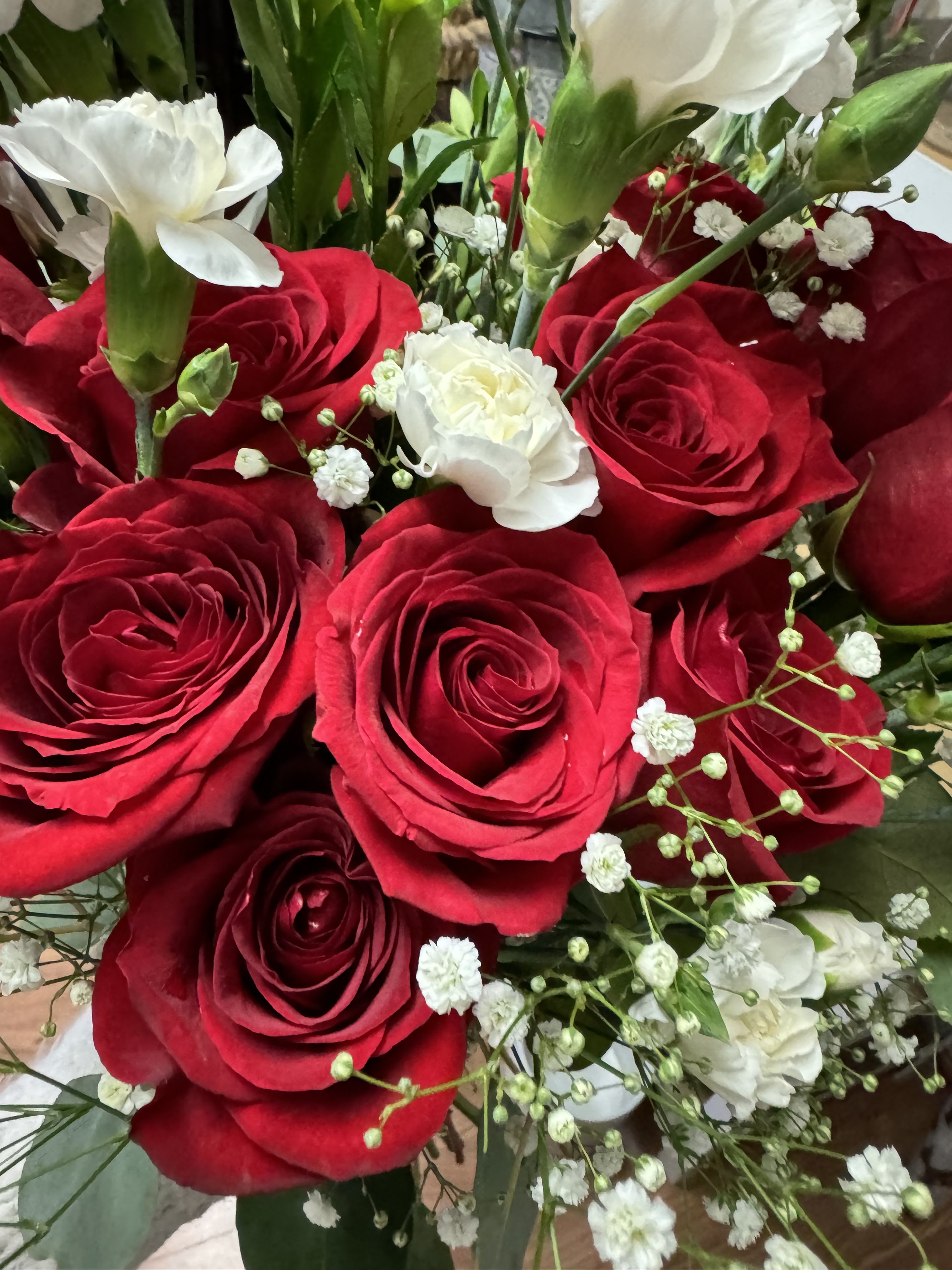 Vibrant Red Blooms by Mercy's Flowers Vibrant Red Blooms by Mercy's Flowers - Red and white with greens for warmth and Passion .