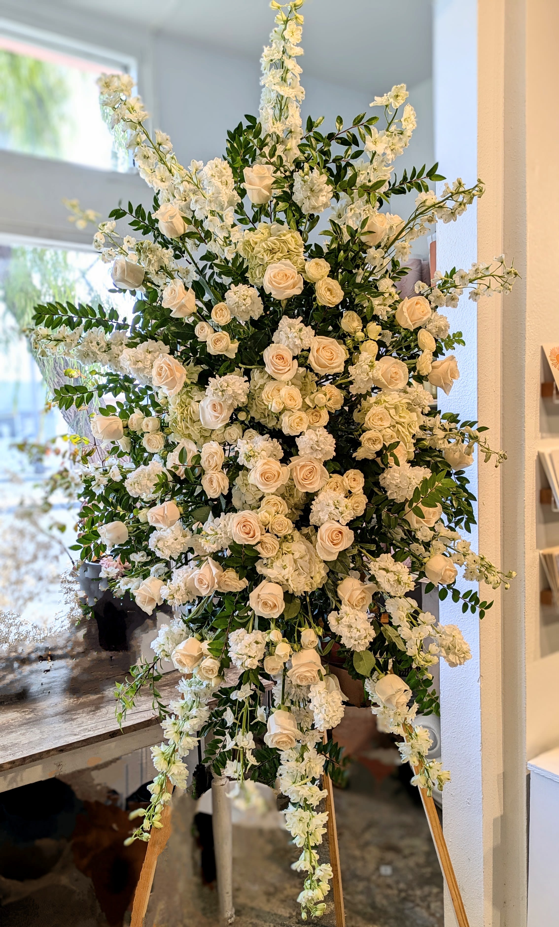 Purely White Standing Spray Purely White Standing Spray - A full, clean, design that stands to be about 5 ft tall and 3.5ft wide (not counting the easel height).