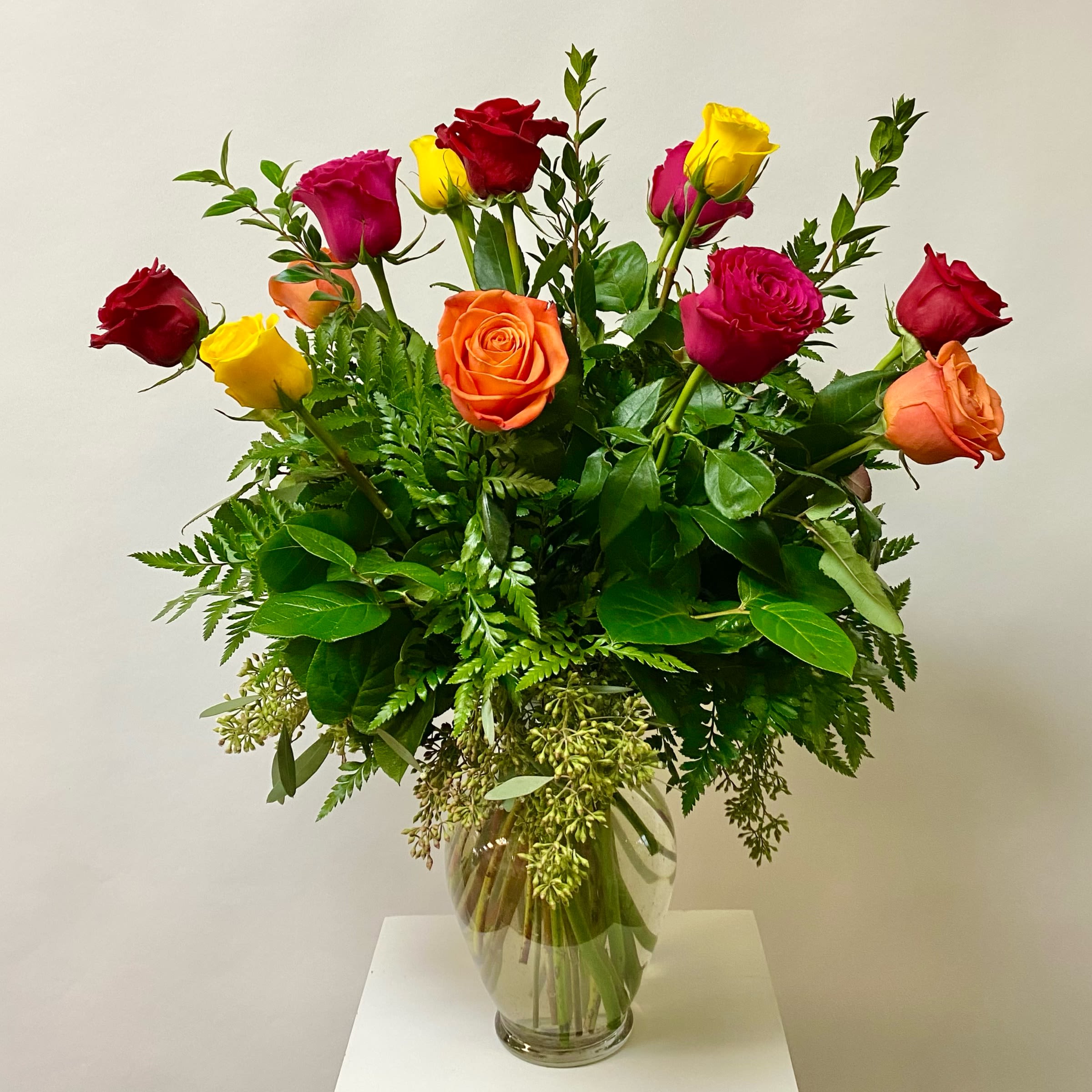 Mix Color Dozen Roses - Mix Colored Roses and Greenery Arranged in a Glass Vase.