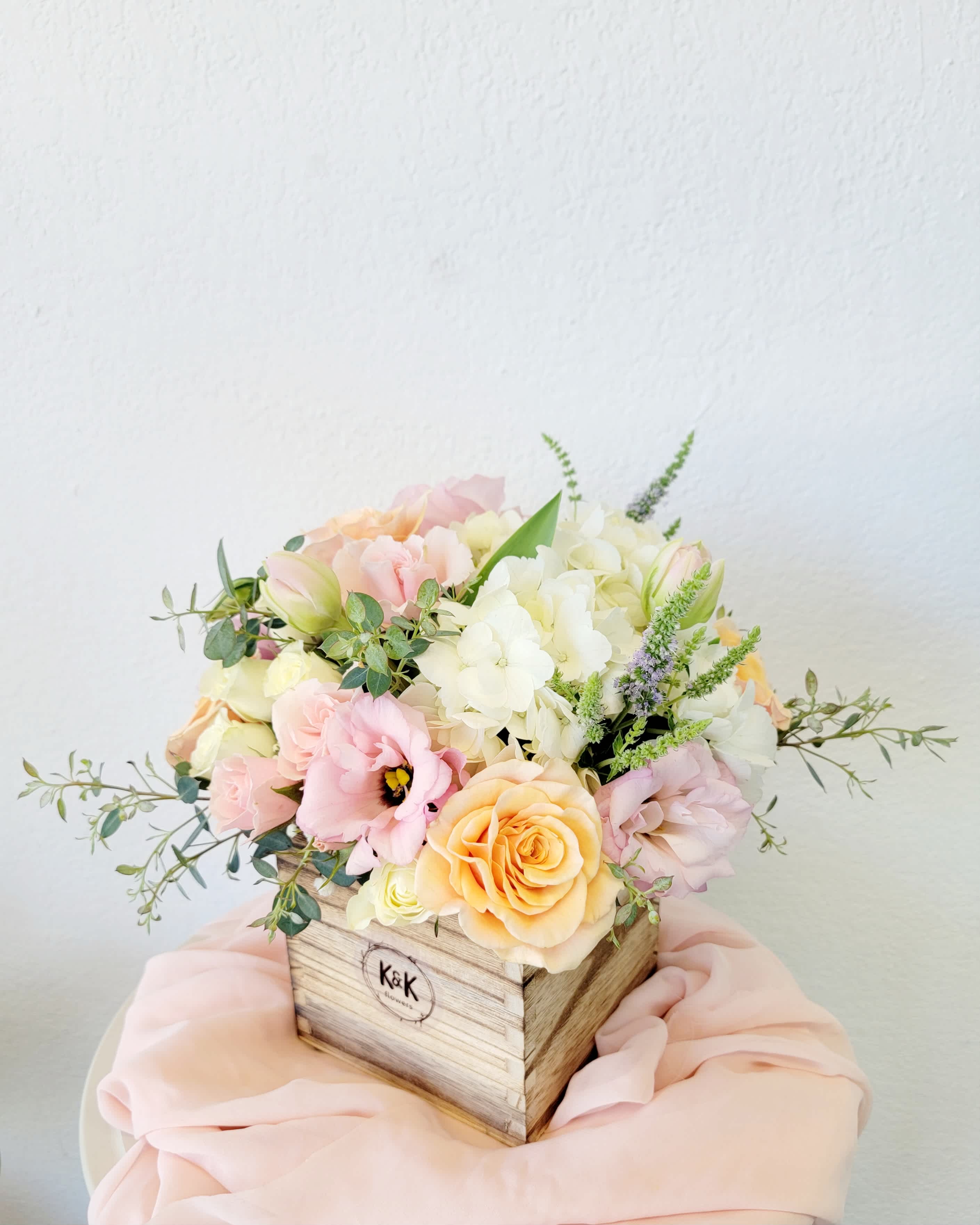 Small Wood Box arrangement Soft Colors  Small Wood Box arrangement Soft Colors  - Wood box, mixed flowers, soft colors. Flowers in boxes don’t need vases. That makes it perfect for transportation and keeping flowers hydrated and secure.