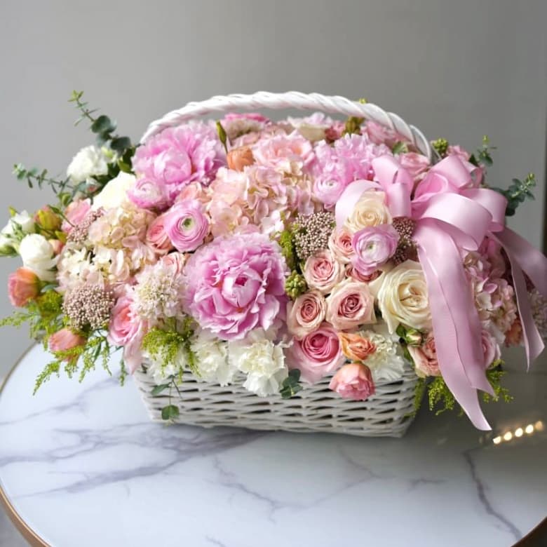 Dream Basket - Embrace the magic of dreams with our "Dream Basket," a stunning floral arrangement. Presented in a charming basket, this exquisite bouquet features a beautiful blend of soft pink and white blooms, carefully arranged to showcase nature’s elegance and grace. Perfect for any occasion, the "Dream Basket" brings a touch of beauty and charm wherever it goes.