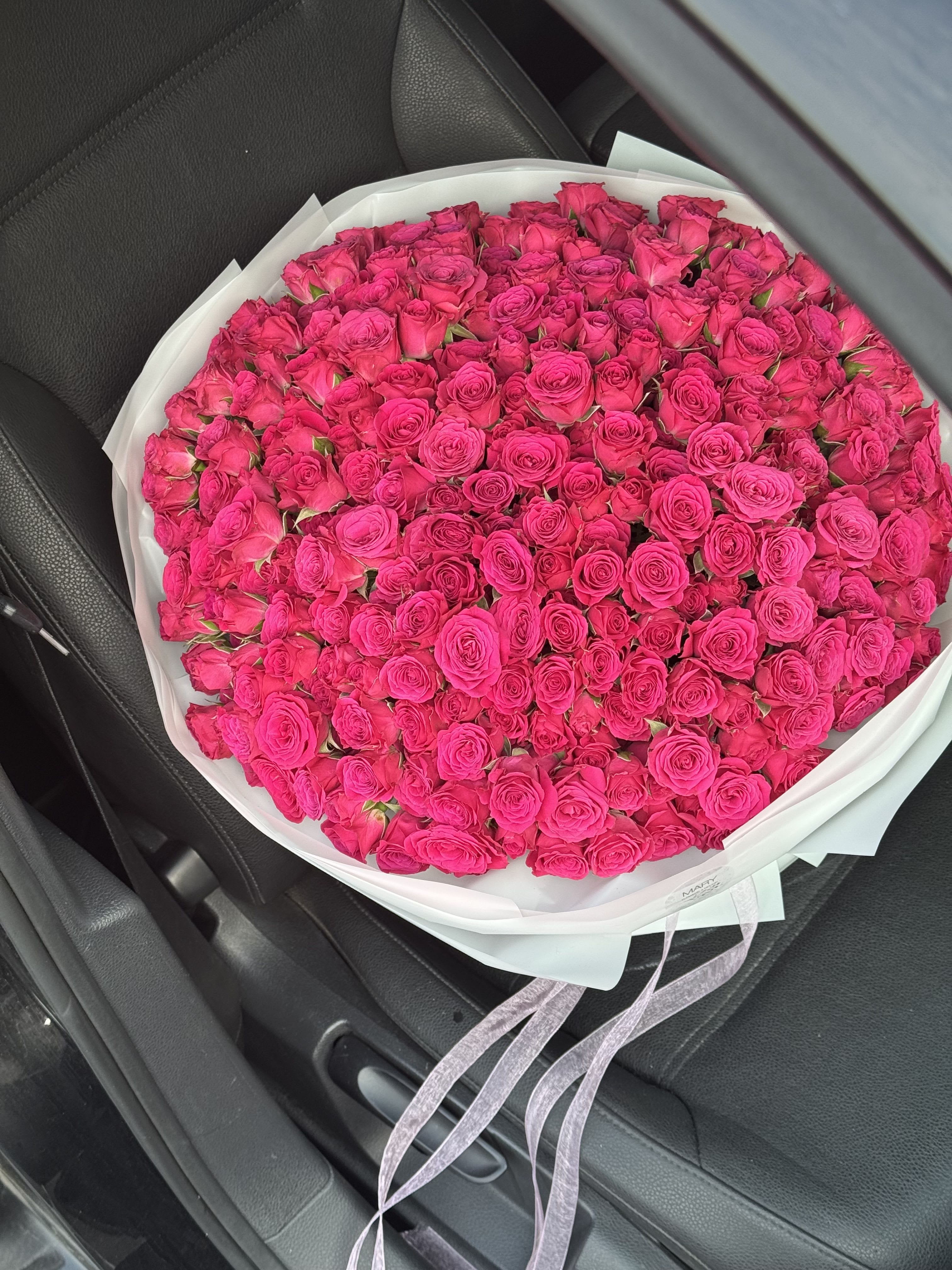 A Luxurious Bouquet of Pink Spray Roses - There is something undeniably charming about spray roses. Unlike traditional single-stem roses, spray roses bloom in delicate clusters of smaller blossoms, giving each stem a sense of abundance and fullness. When gathered together in a grand arrangement, these miniature roses transform into a breathtaking bouquet that radiates elegance, softness, and romance.  This large bouquet of pink spray roses is a celebration of beauty in its purest form. The countless petite blossoms create layers of texture and color, resembling a field of roses gathered into one perfect arrangement. Each tiny rose tells its own story, yet together they weave a vision of harmony and grace.  The pink color of the spray roses adds even more tenderness to the bouquet. Pink roses are timeless symbols of admiration, affection, and gratitude. They carry a softness that feels both romantic and joyful, making them the perfect choice for expressing love, celebrating special milestones, or simply brightening someone’s day.  One of the most enchanting qualities of spray roses is their versatility. Their clustered blooms give the bouquet a lush, garden-like feel—natural yet refined, abundant yet delicate. A large bouquet of pink spray roses has the power to impress not only with its size but also with its intricate beauty. It feels both luxurious and approachable, like a gesture from the heart that speaks of care and thoughtfulness. 