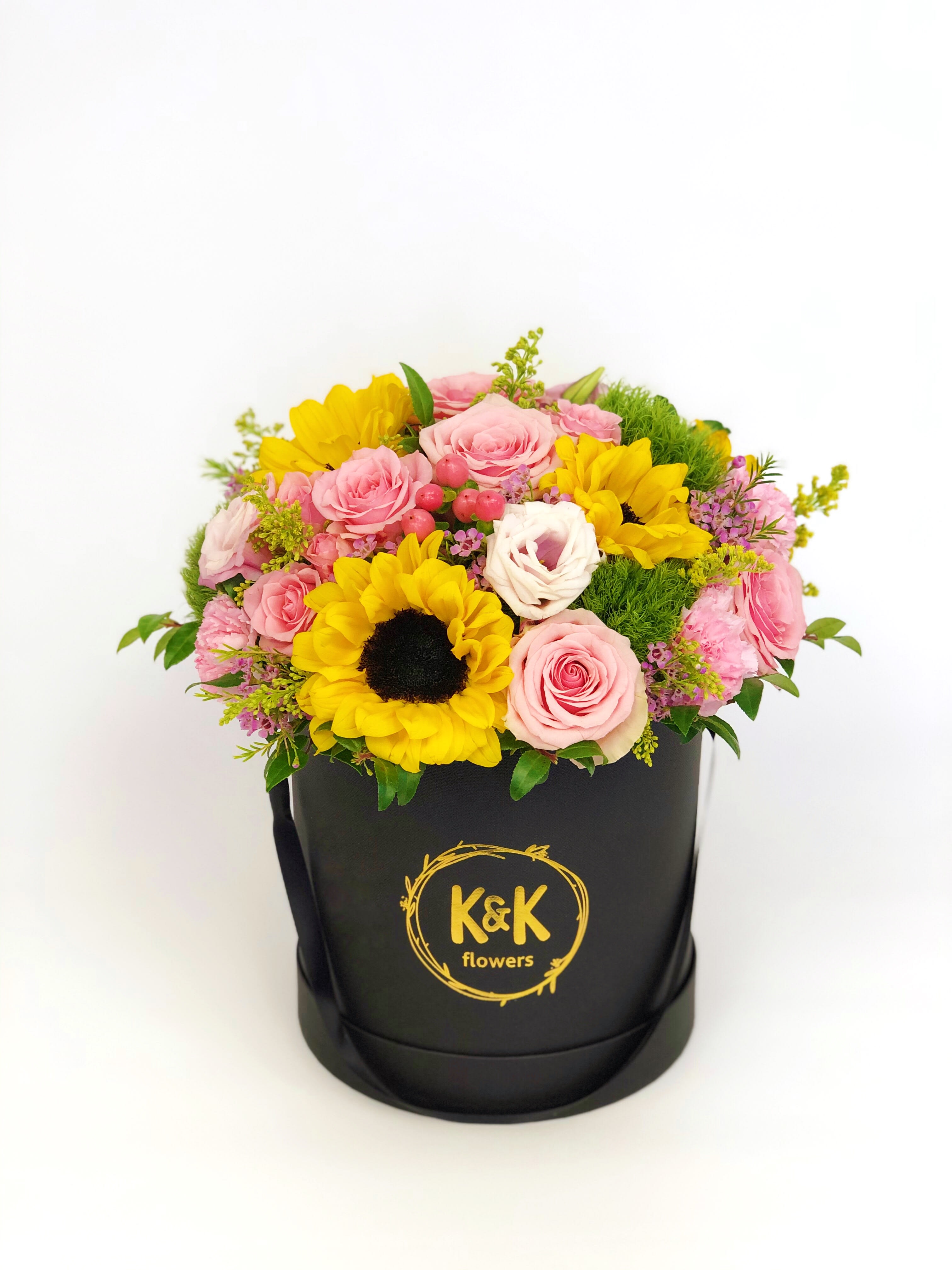Black hat box arrangement Bright  - If You want bouquet with a twist, choose our flower boxes. We have wood boxes for rustic looking arrangements, or hat boxes for a more elegant look. It’s a beautiful and convenient way. Flowers in boxes don’t need vases. That makes it perfect for transportation and keeping flowers hydrated and secure.