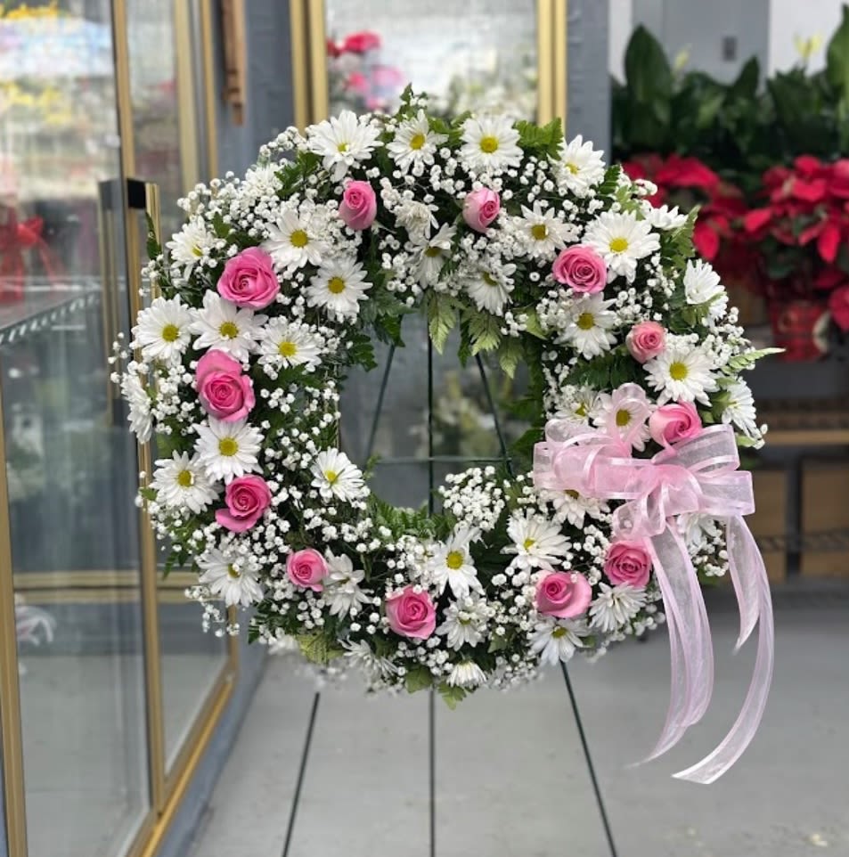 Sympathy Wreath Floral Sympathy Wreath Floral - Sympathy wreath in white, add a touch of color with your choice of color roses.