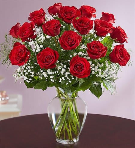 Two Dozen Roses Arranged Two Dozen Roses Arranged - Twenty four gorgeous red roses arranged into a glass vase with greenery, fancy filler, and all the works.