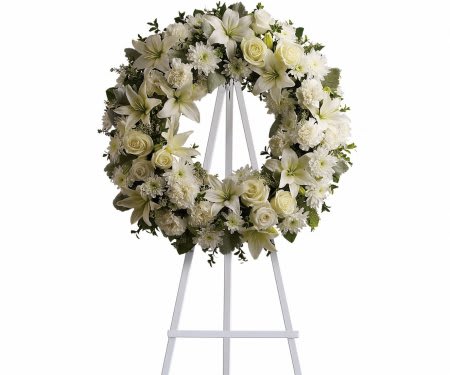 Serenity Wreath Serenity Wreath - An all white hanging wreath made with fresh white blooms and greenery. Stands are included with all wreaths and standing sprays.