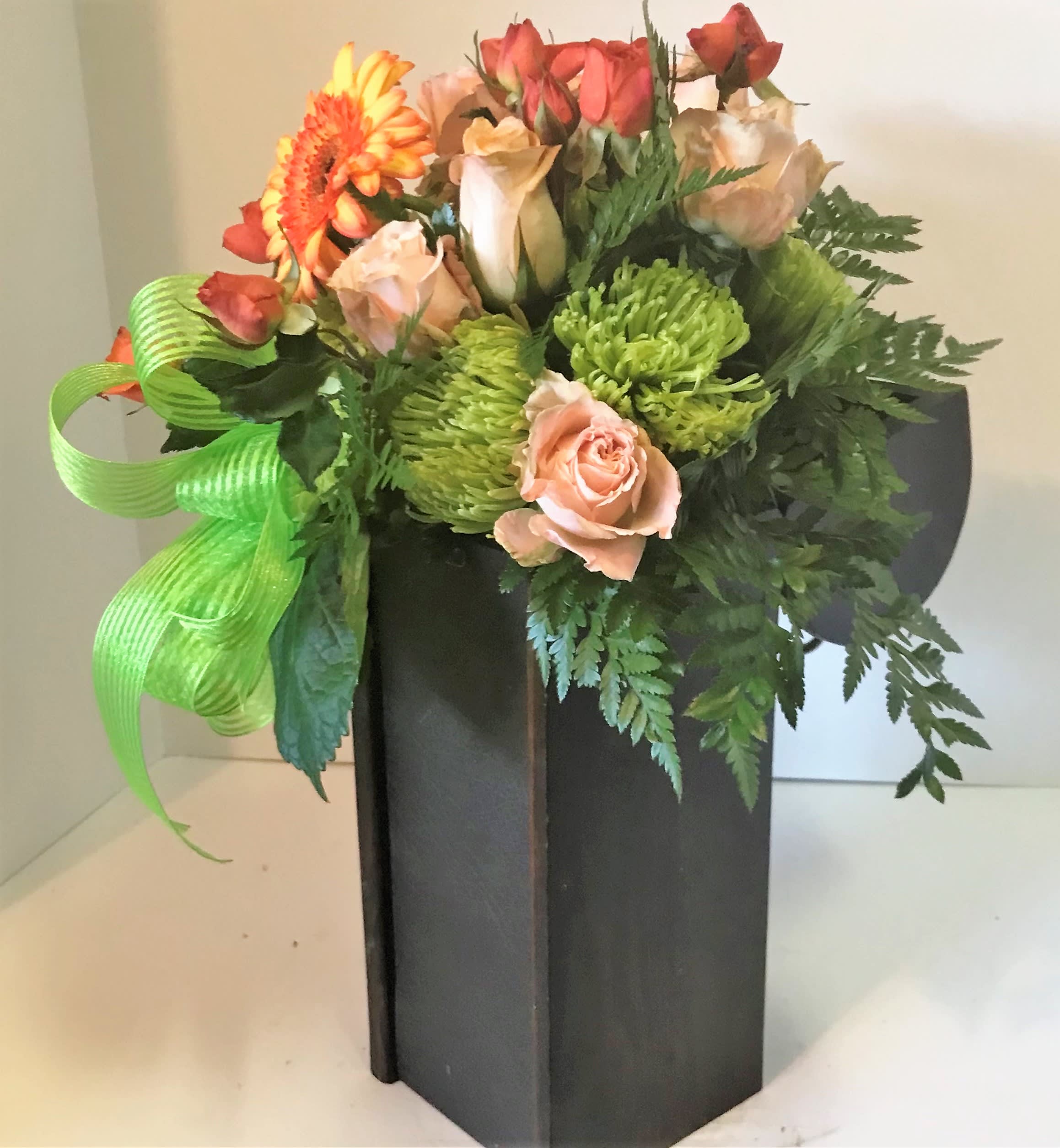 UNDERSTANDING - ROSES, MUMS AND ASSORTED SEASONAL BLOOMS IN A CUSTOM CONTAINER.