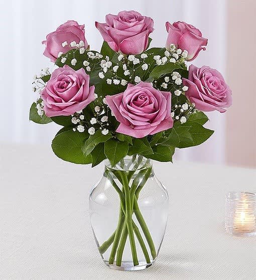 classic 6 purple rose vase - classic purple roses. Artistically arranged by our skilled florists with lush greenery inside an elegant glass vase, six purple roses are delivered right to the door to delight them for a special celebration or an out-of-the-blue surprise.