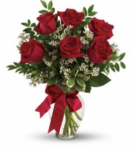 Classic half-dozen roses Classic half-dozen roses - Roses are always the perfect gift, no matter the occasion. Using only the freshest roses and mixed greens with an accent of baby's breath or wax flower, we will create a beautiful arrangement. 6 RED ROSES ARRANGED **** for color options please call otherwise red will be sent!! # Please note container selection may vary due to limited production of vase style from our wholesalers. Substitutions may occur and or color may vary. Thank you for understanding. *For other colors, please call us for availability.