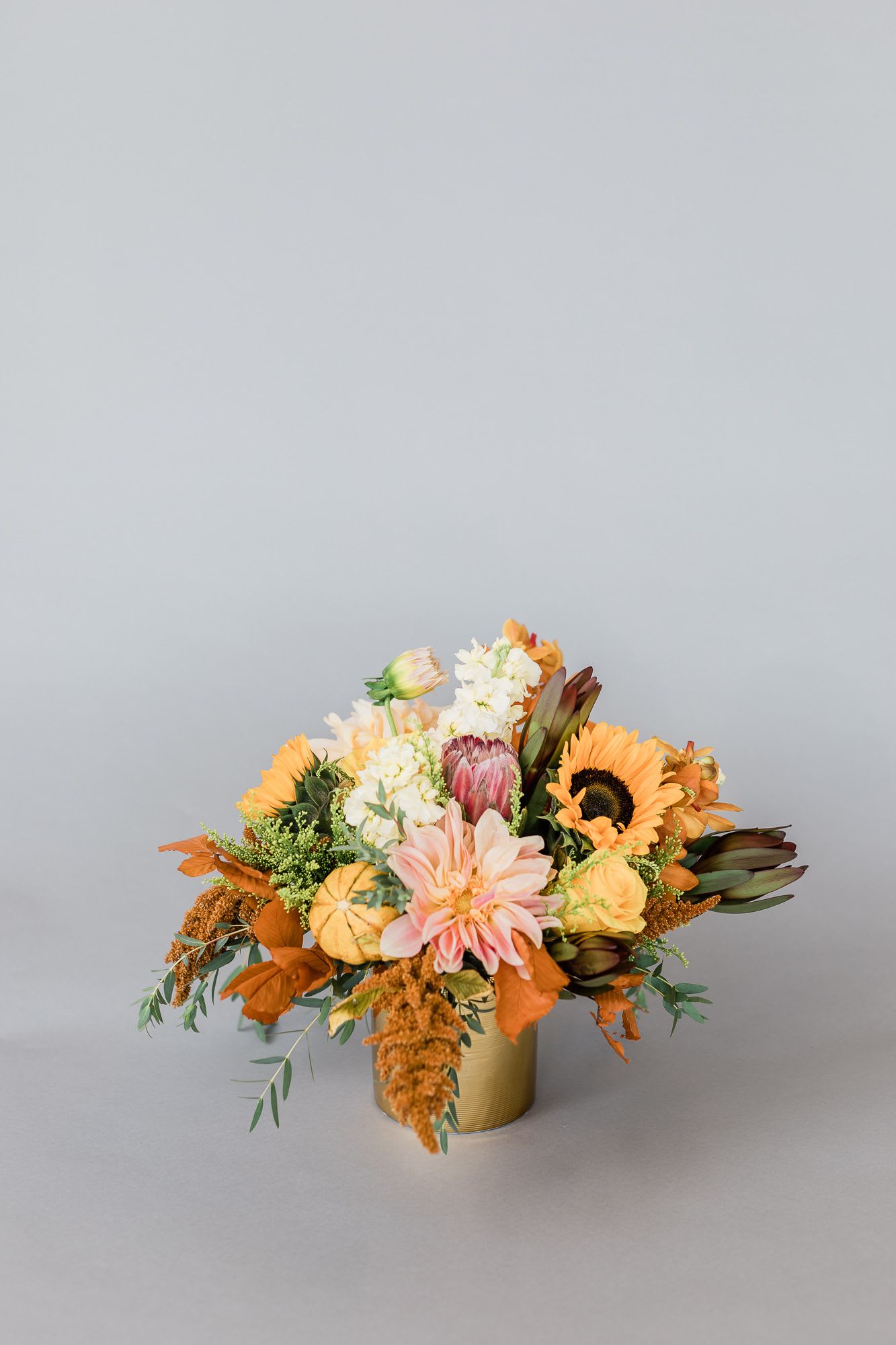 Fall Garden Blooms - This creation is beautifully arranged in a gold ceramic vase with seasonal flowers.   pictured: [STANDARD]