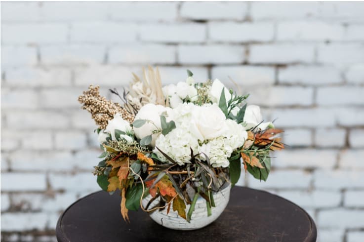 Harvest Bubble Blooms - Stunning mix of harvest textures and ivory blooms eloquently designed in a clear glass bubble bowl.   Pictured [DELUXE]