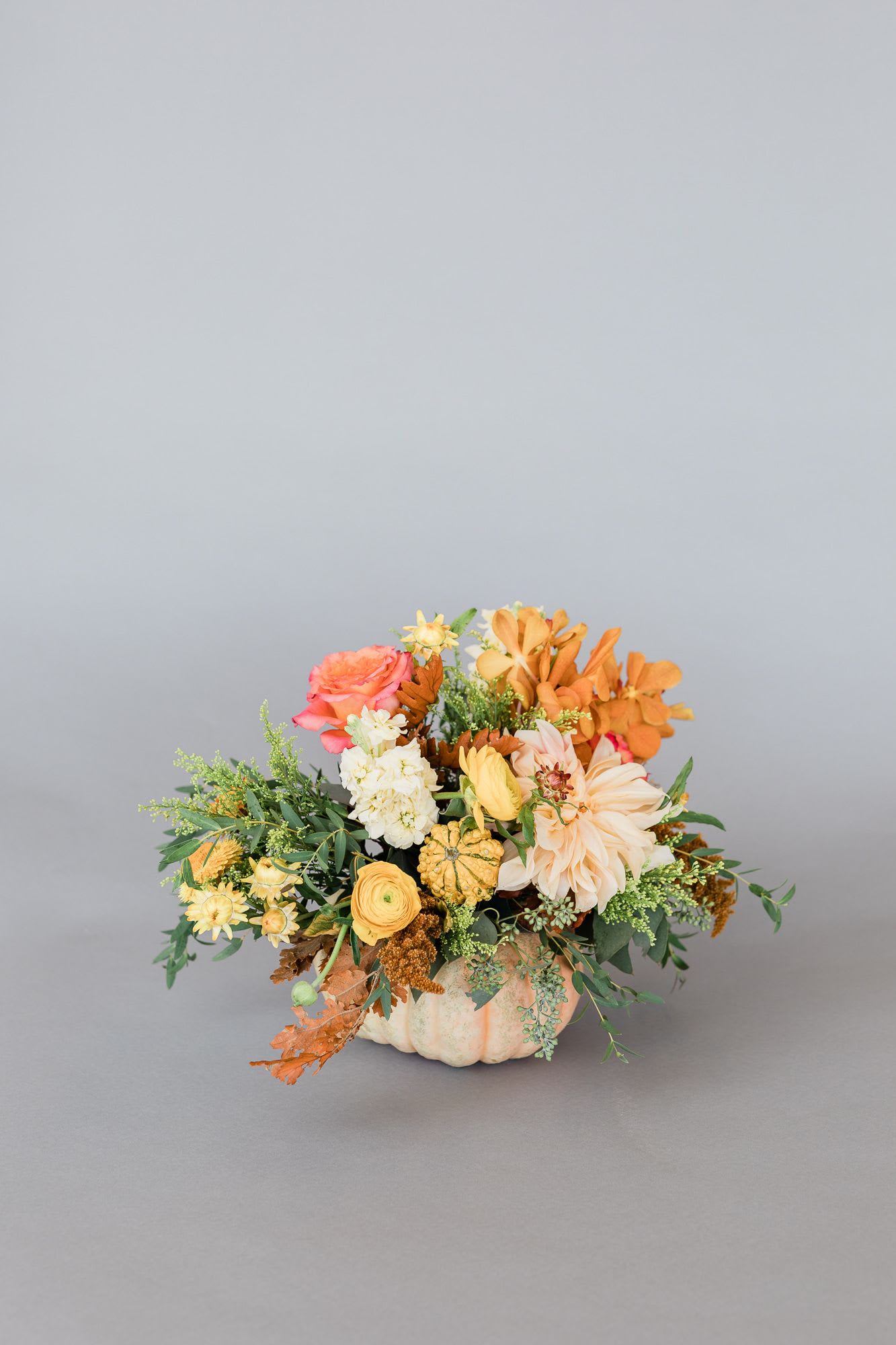 Pumpkin Garden Picks - Stunning Autumn mix of seasonal blooms and textures for the holidays! Eloquently designed in a ceramic pumpkin, perfect centerpiece for your dinner table!   pictured [DELUXE]