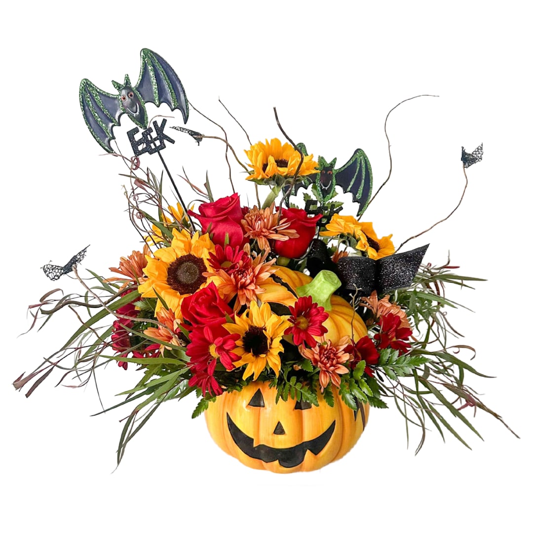 Jack-O-Lantern - This Jack-O-Lantern is the best spooky season gift! Full of seasonal blooms and bats, it's sure to make someone's day and the ceramic candy dish container makes it even better! Halloween picks may vary.