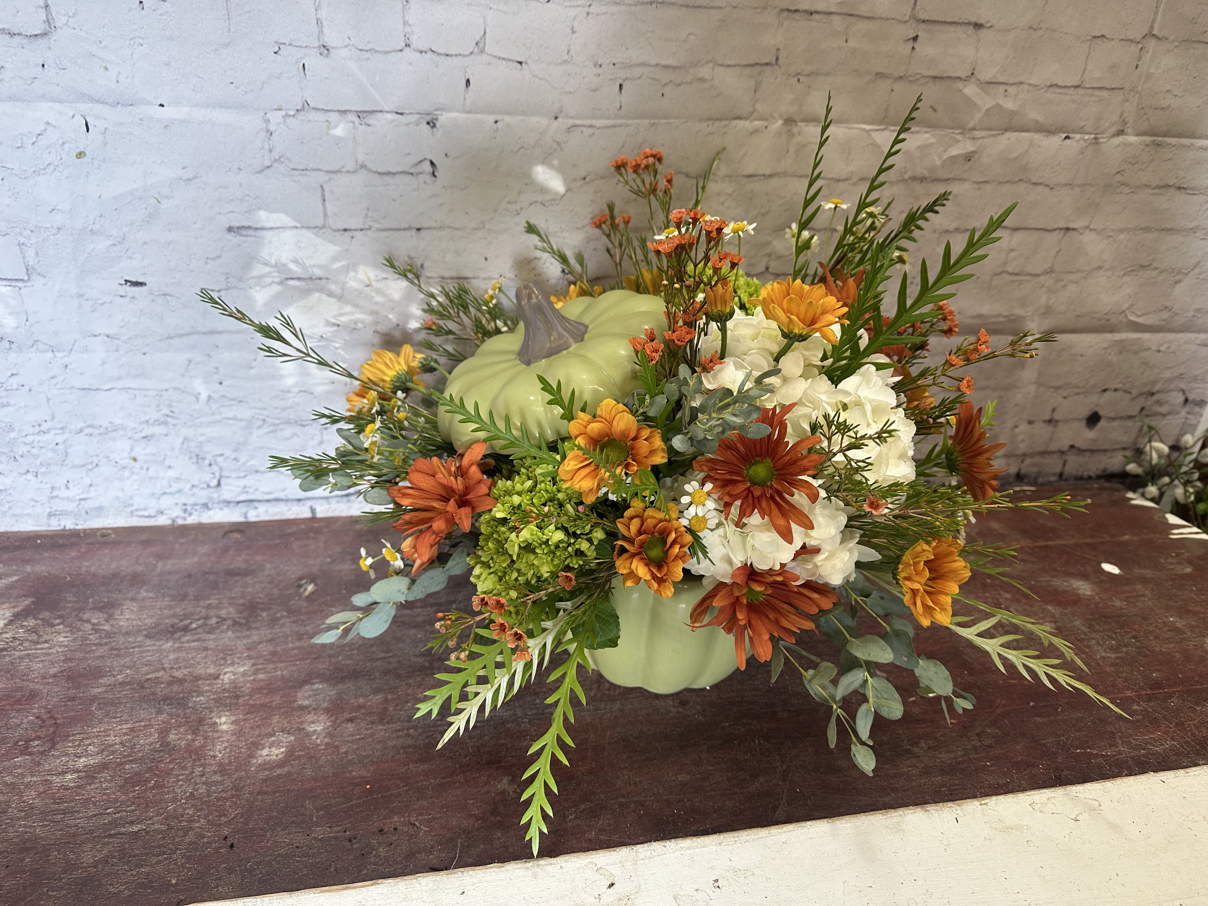 Sage + Spice  - Green pumpkin with dainty fall florals for the perfect centerpiece 