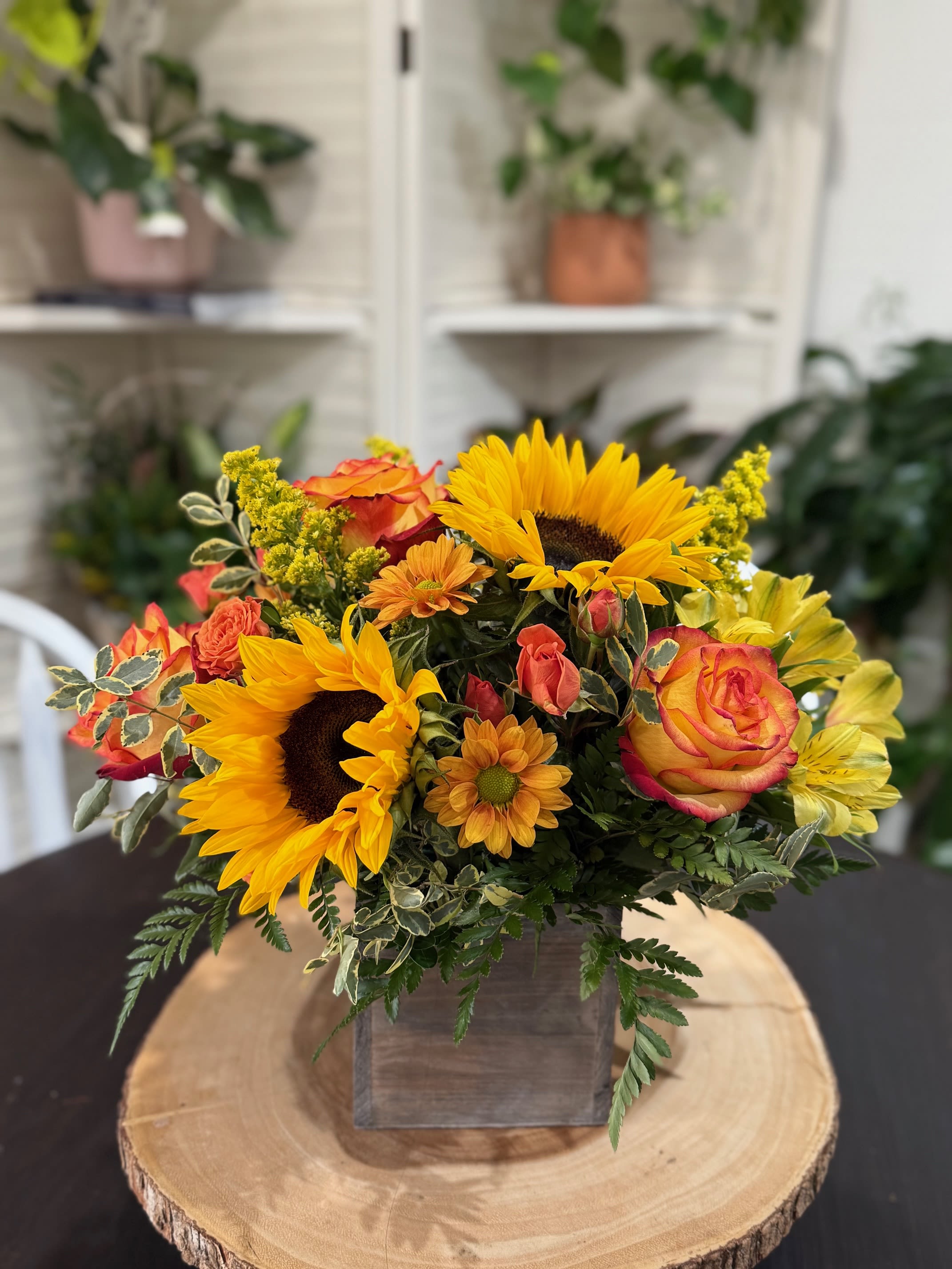 Golden Harvest  - Celebrate the warmth of the season with our Golden Harvest arrangement- a cheerful mix of vibrant fall blooms designed to brighten any space.  Please note: Flower varieties and shades may vary, but the autumn charm remains the same.