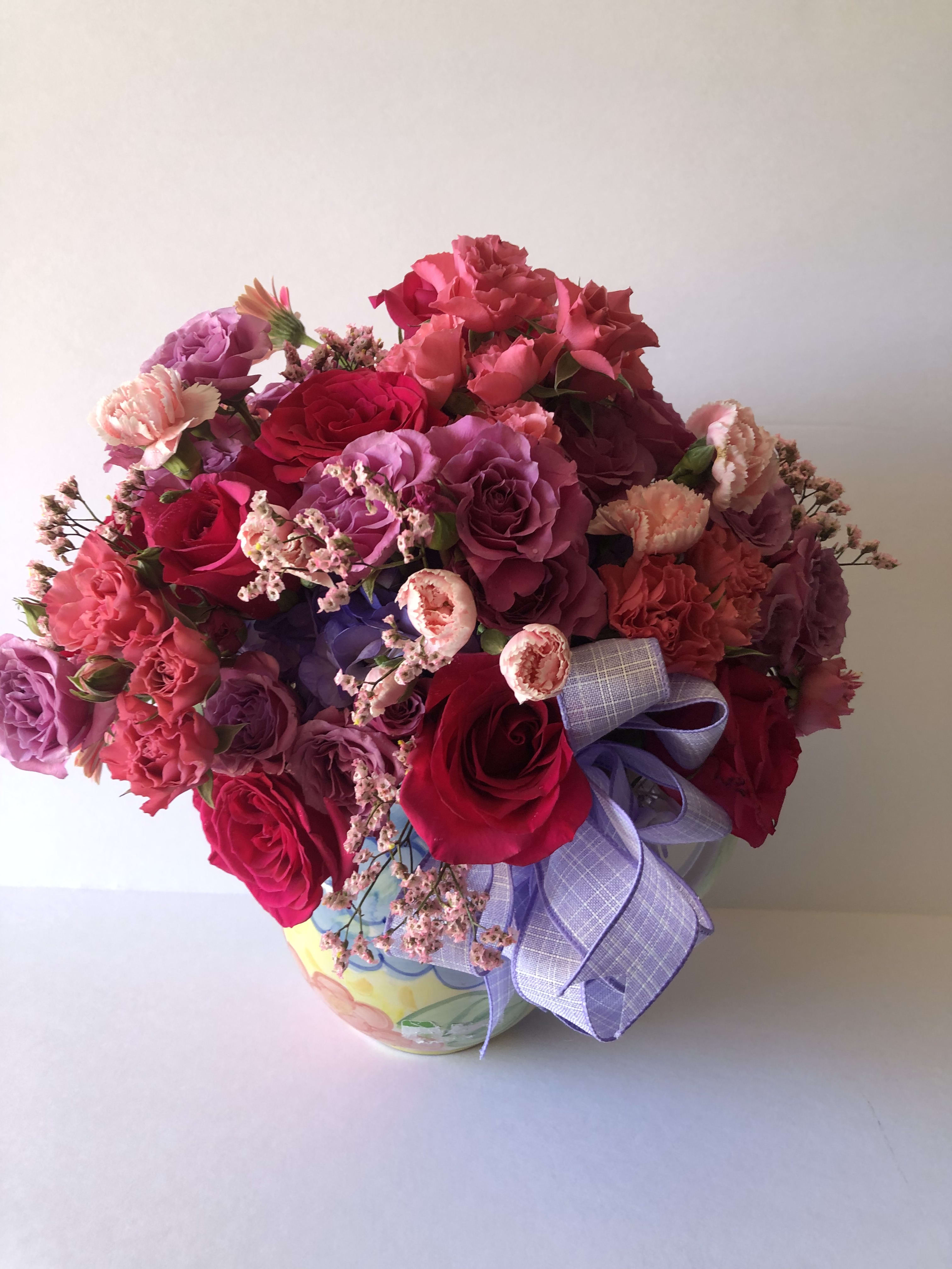 Abundant Pitcher - A lovely pitcher filled with hot pink, pink, and lavender blooms.