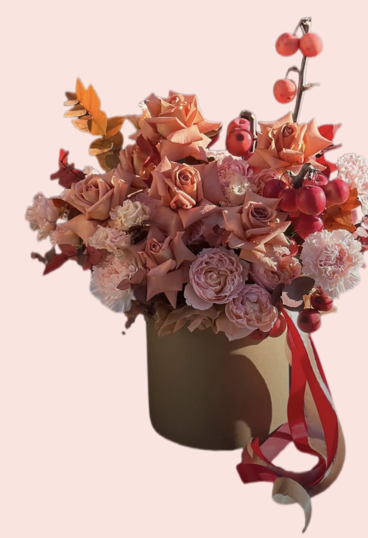 Autumn Arrangement in an Orange Hat Box Autumn Arrangement in an Orange Hat Box - Autumn is the season of golden sunsets, cozy evenings, and warm, rich colors that bring a special kind of magic into our lives. To capture this seasonal beauty, nothing compares to an autumn flower arrangement in an orange hat box — a stylish and modern way to showcase the essence of fall in a truly unforgettable design. Why a hat box arrangement? Hat boxes have become one of the most fashionable ways to present flowers. They combine elegance and convenience, offering a chic alternative to traditional vases. The vibrant orange color of the box perfectly reflects the tones of autumn — fiery leaves, ripe pumpkins, and golden light. It not only enhances the flowers inside but also creates a polished and luxurious appearance. Flowers that define autumn An autumn arrangement is often built on a palette of warm, earthy, and bold tones. Think of orange roses, rust-colored chrysanthemums, burgundy dahlias, golden sunflowers, and soft beige or cream blooms for balance. Seasonal foliage such as eucalyptus, oak leaves, or decorative berries adds texture and depth, turning the arrangement into a masterpiece of nature.
