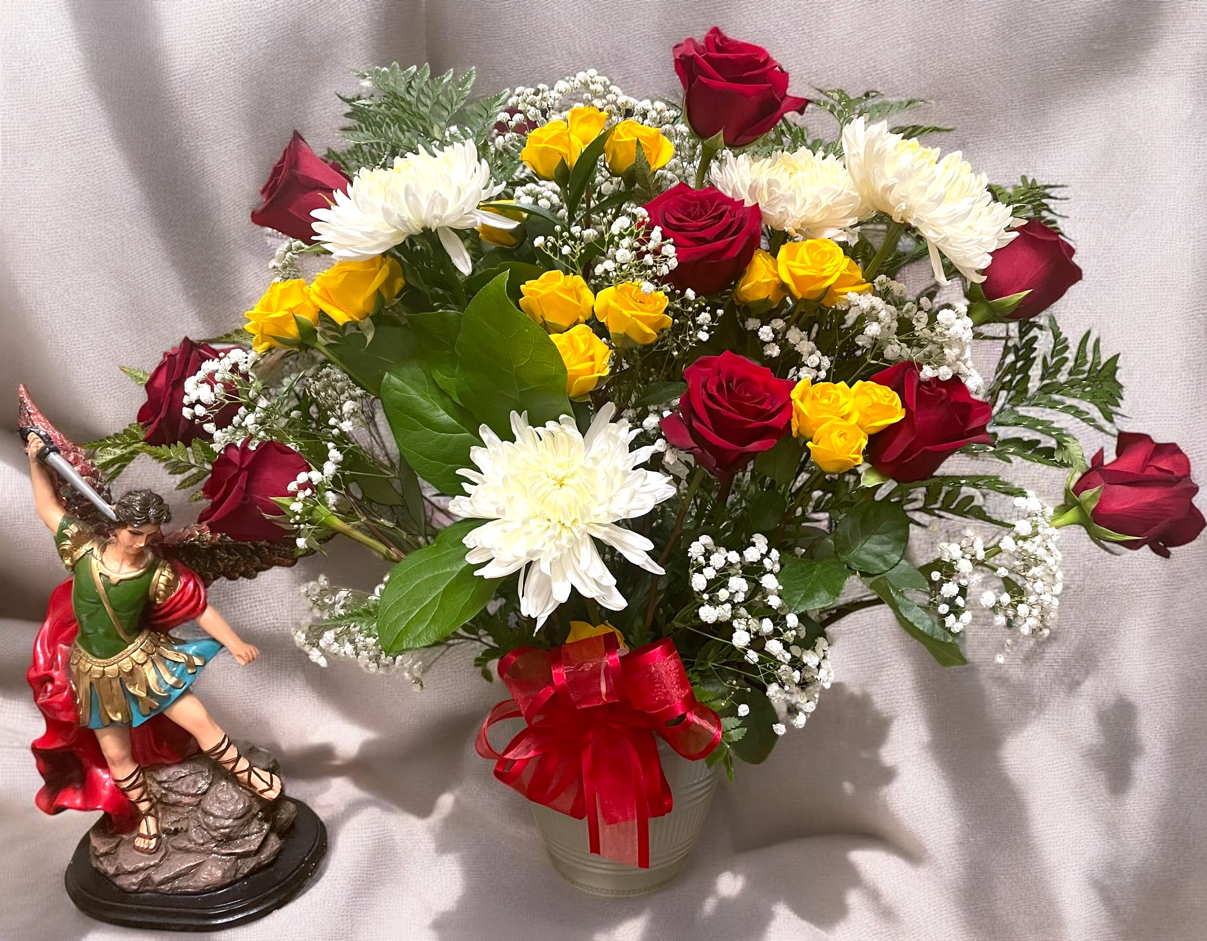 Heavenly Devotion  - The combination of deep red roses, cheerful yellow mini roses, and pure white chrysanthemums evokes a sense of elegance, passion, and purity.
