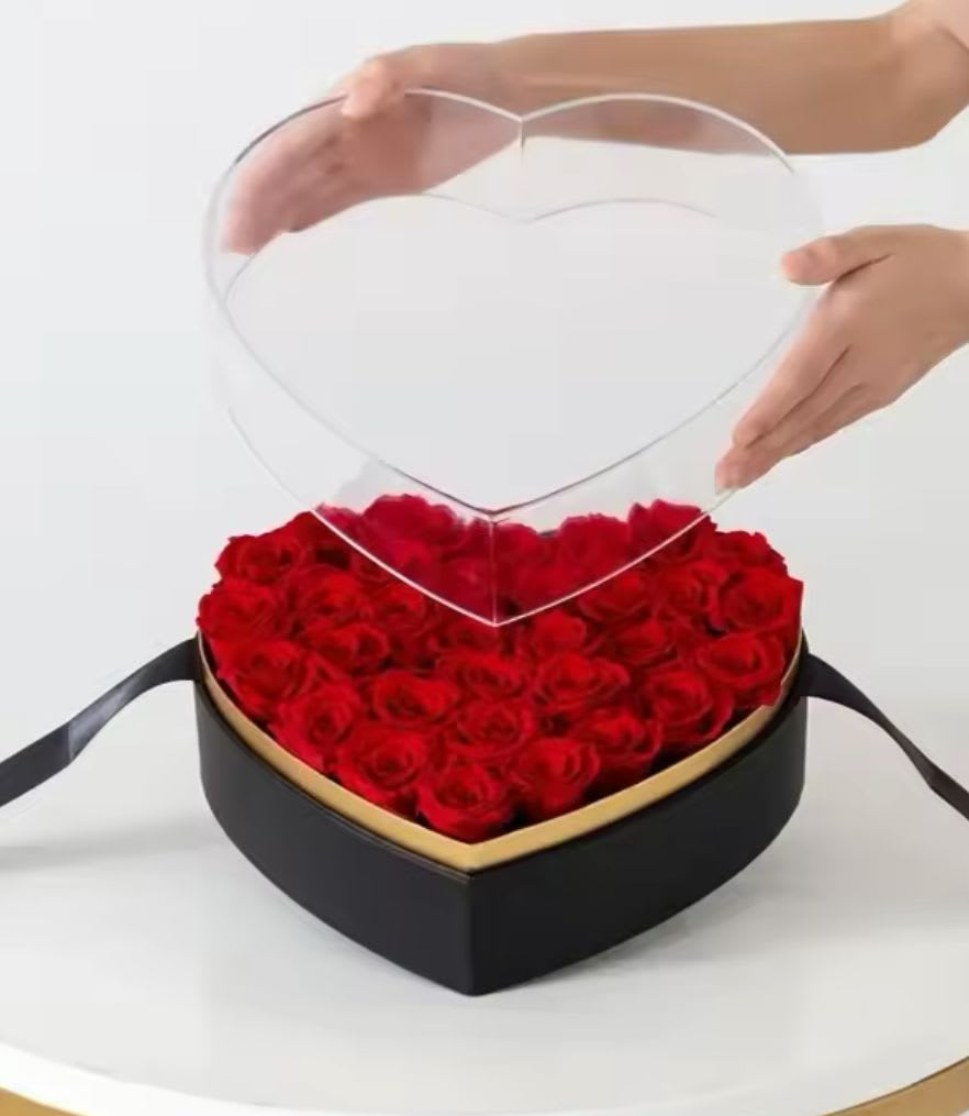 Heart-shaped acrilyc box - Black heart-shaped acrylic box with golden details full of red roses.